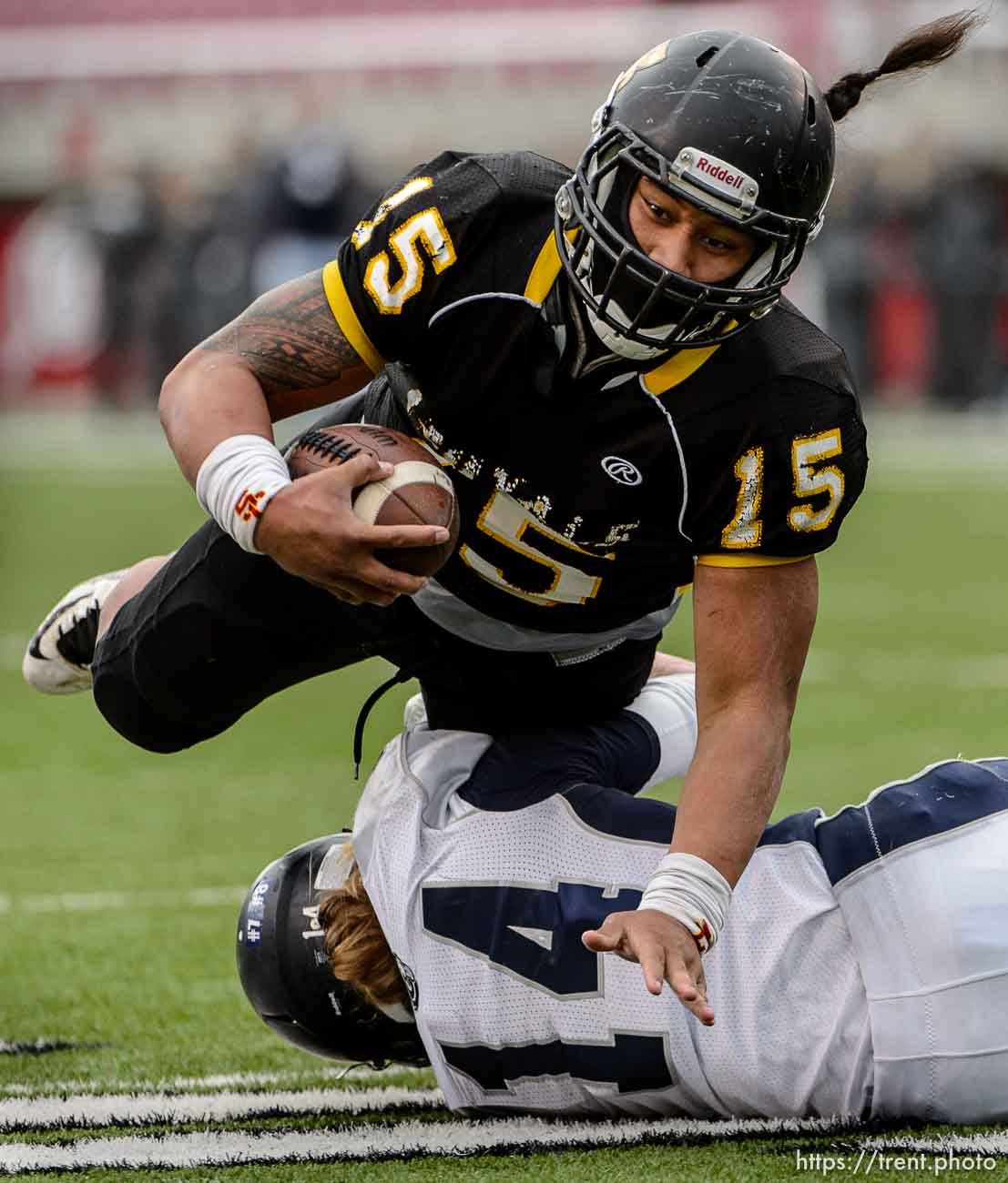 Trent Nelson  |  The Salt Lake Tribune
Roy's Baby Eteuati runs into Corner Canyon's Garrett Michaeli as Roy defeats Corner Canyon High School in a 4A state football semifinal game at Rice-Eccles Stadium in Salt Lake City, Friday November 14, 2014.