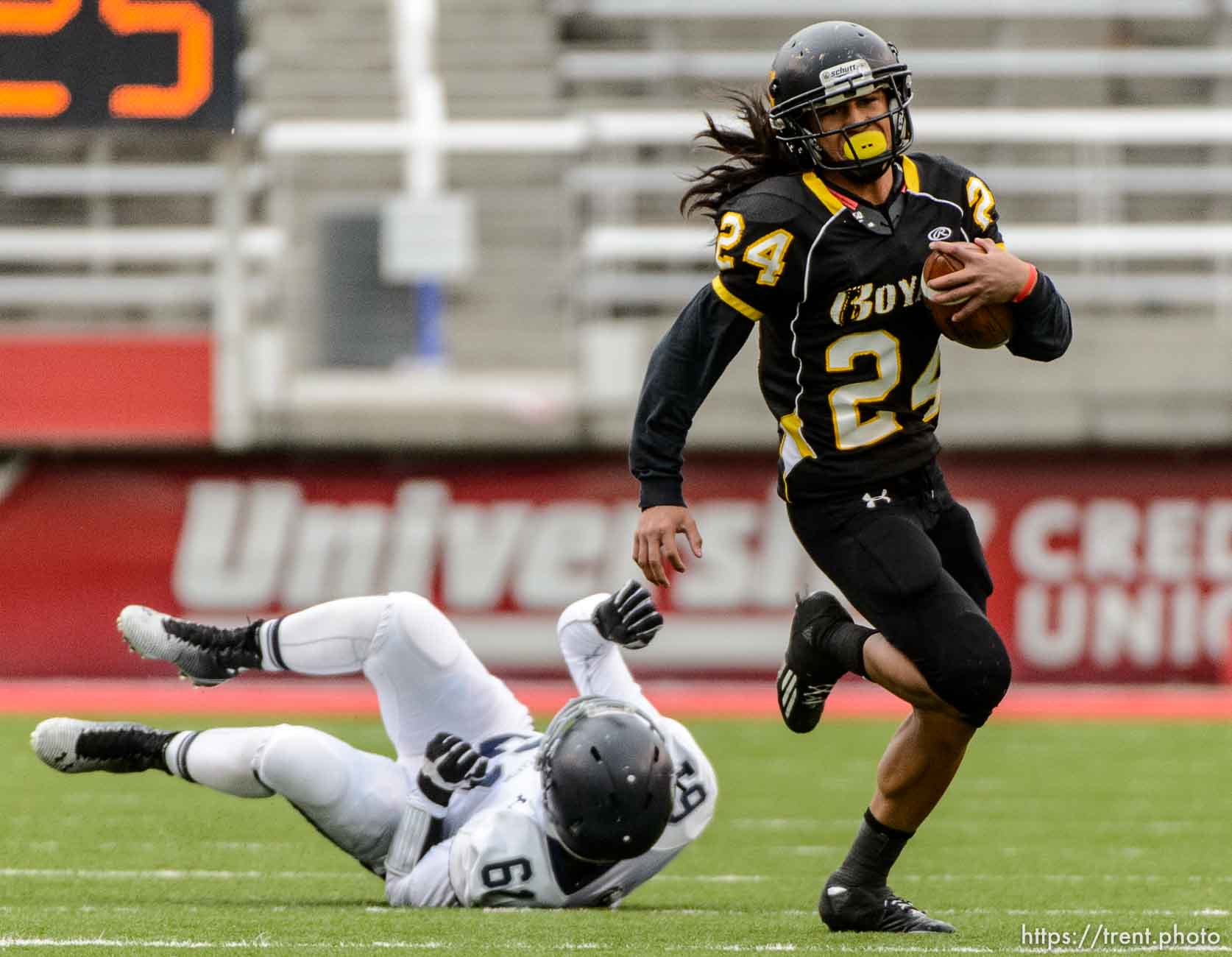 Trent Nelson  |  The Salt Lake Tribune
Roy's Tyler Eteuati runs the ball as Roy defeats Corner Canyon High School in a 4A state football semifinal game at Rice-Eccles Stadium in Salt Lake City, Friday November 14, 2014.