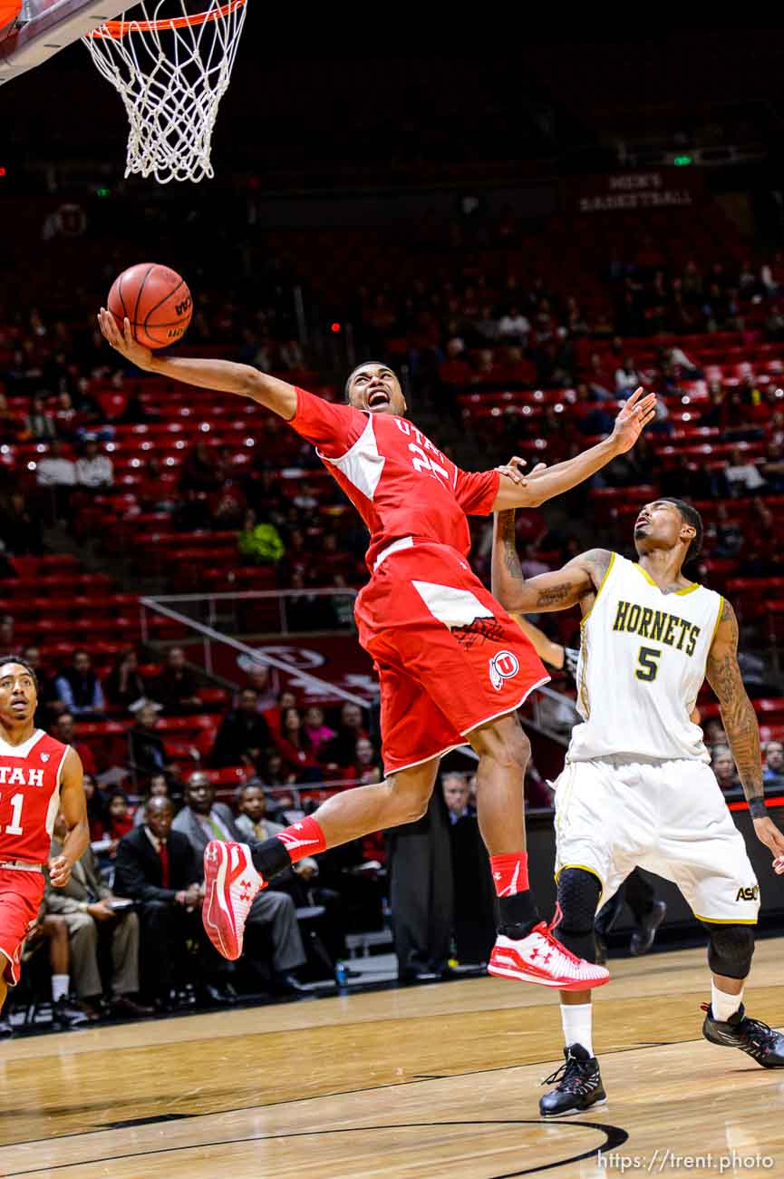 Trent Nelson  |  The Salt Lake Tribune
Utah Utes guard Kenneth Ogbe (25) sinks an incredible shot as he's fouled by Alabama State Hornets guard Bobby Brown (5). University of Utah Utes host the Alabama State Hornets, college basketball at the Huntsman Center in Salt Lake City, Saturday November 29, 2014.