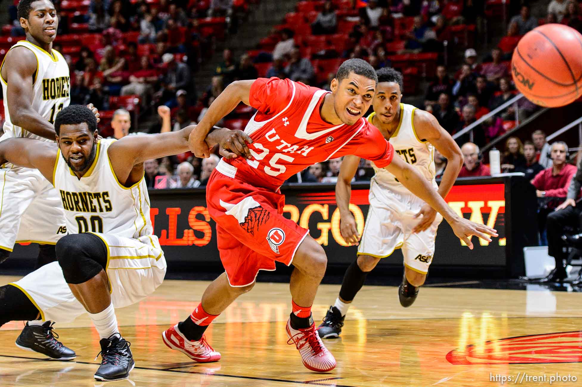 Trent Nelson  |  The Salt Lake Tribune
Alabama State Hornets center Wendell Lewis (00) holds onto Utah Utes guard Kenneth Ogbe (25) as the University of Utah Utes host the Alabama State Hornets, college basketball at the Huntsman Center in Salt Lake City, Saturday November 29, 2014.