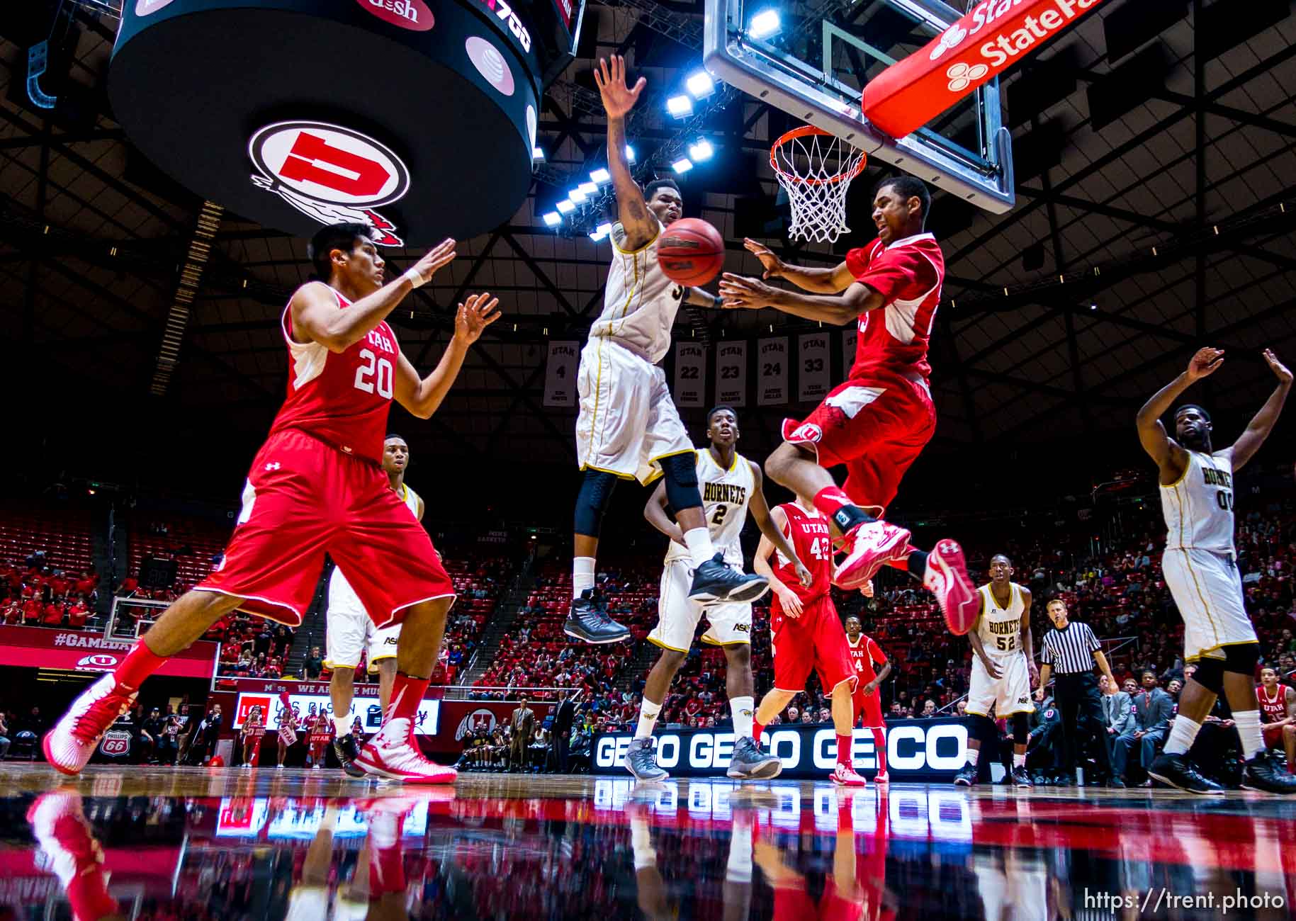 Trent Nelson  |  The Salt Lake Tribune
Utah Utes guard Kenneth Ogbe (25) passes to forward Chris Reyes (20) as Alabama State Hornets guard Bobby Brown (5) defends as the University of Utah Utes host the Alabama State Hornets, college basketball at the Huntsman Center in Salt Lake City, Saturday November 29, 2014.