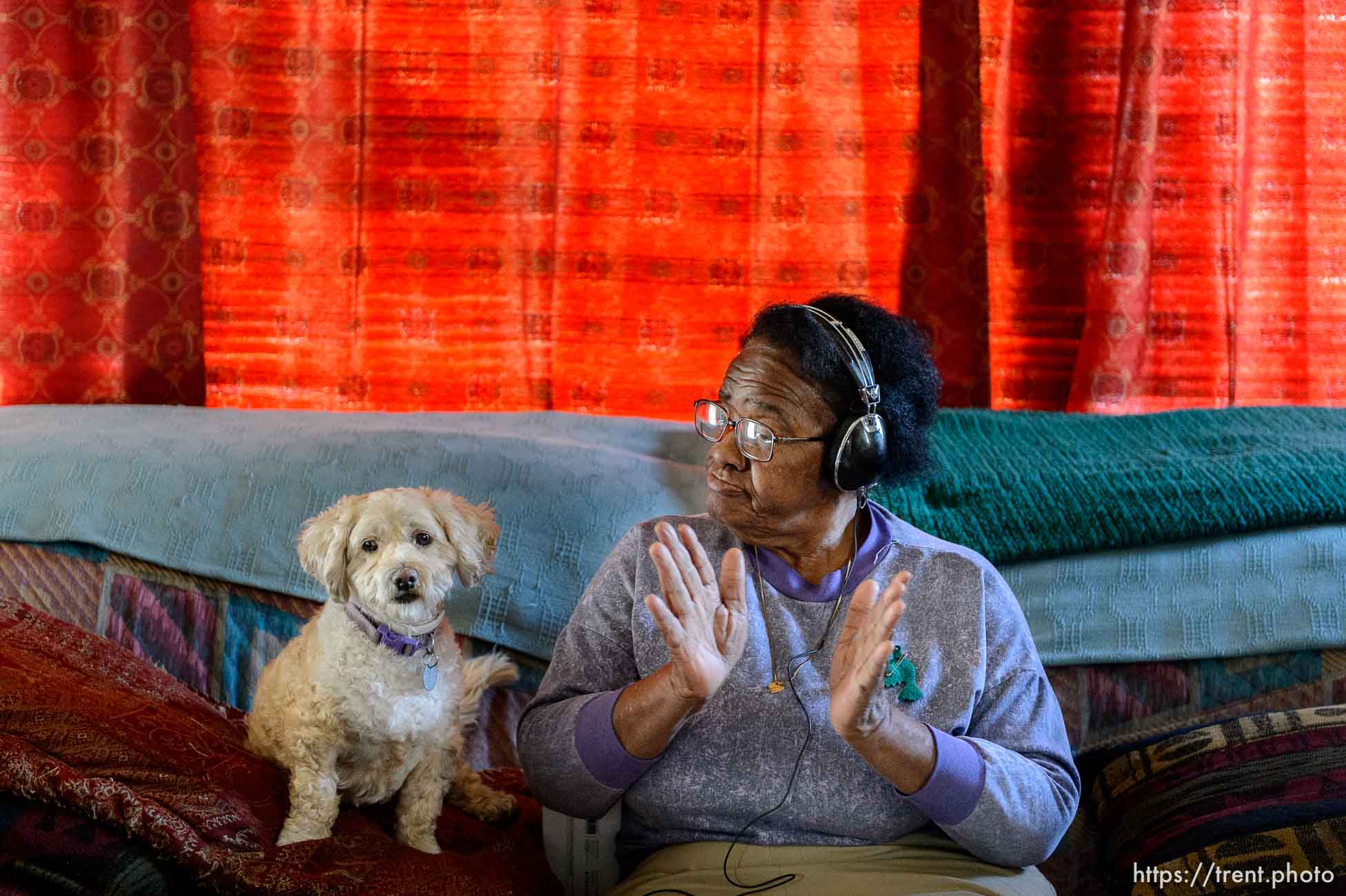 Trent Nelson  |  The Salt Lake Tribune
With her dog Harry keeping her company, Ruth Govan listens to soul on an iPod provided by Jewish Family Services, in Salt Lake City, Thursday November 6, 2014. About 30 Utah residents with Alzheimer's or dementia are receiving iPods with playlists tailored to their own musical tastes.