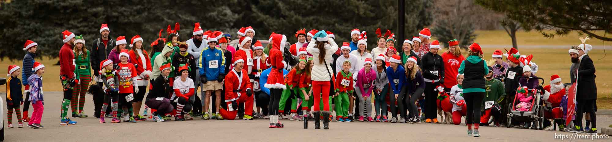 Trent Nelson  |  The Salt Lake Tribune
Runners pose for a group photo at the start of the Santa Hat Dash 5K in Sugar House Park, Salt Lake City, Saturday December 20, 2014. The run encourages Santa hats and costumes —reindeer, snowmen, elves, etc. Participants also donated warm clothing, blankets and toiletries to The Road Home Shelter.