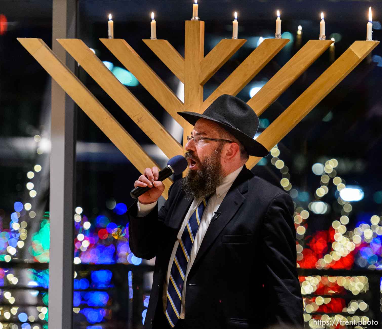 Trent Nelson  |  The Salt Lake Tribune
Rabbi Benny Zippel sings after lighting the sixth candle of Chanukah as Chabad Lubavitch of Utah hosts Chanukah on Ice at the Gallivan Center in Salt Lake City, Sunday December 21, 2014.