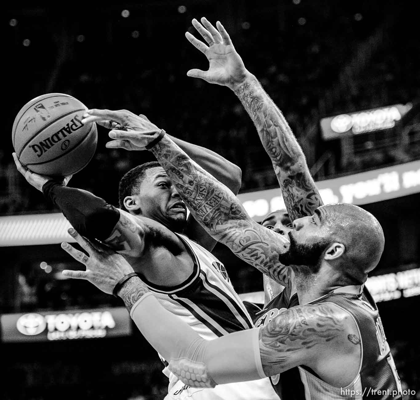 Utah Jazz guard Trey Burke (3) runs into Los Angeles Lakers forward Carlos Boozer (5) as the Utah Jazz host the Los Angeles Lakers at EnergySolutions Arena in Salt Lake City, Wednesday February 25, 2015.