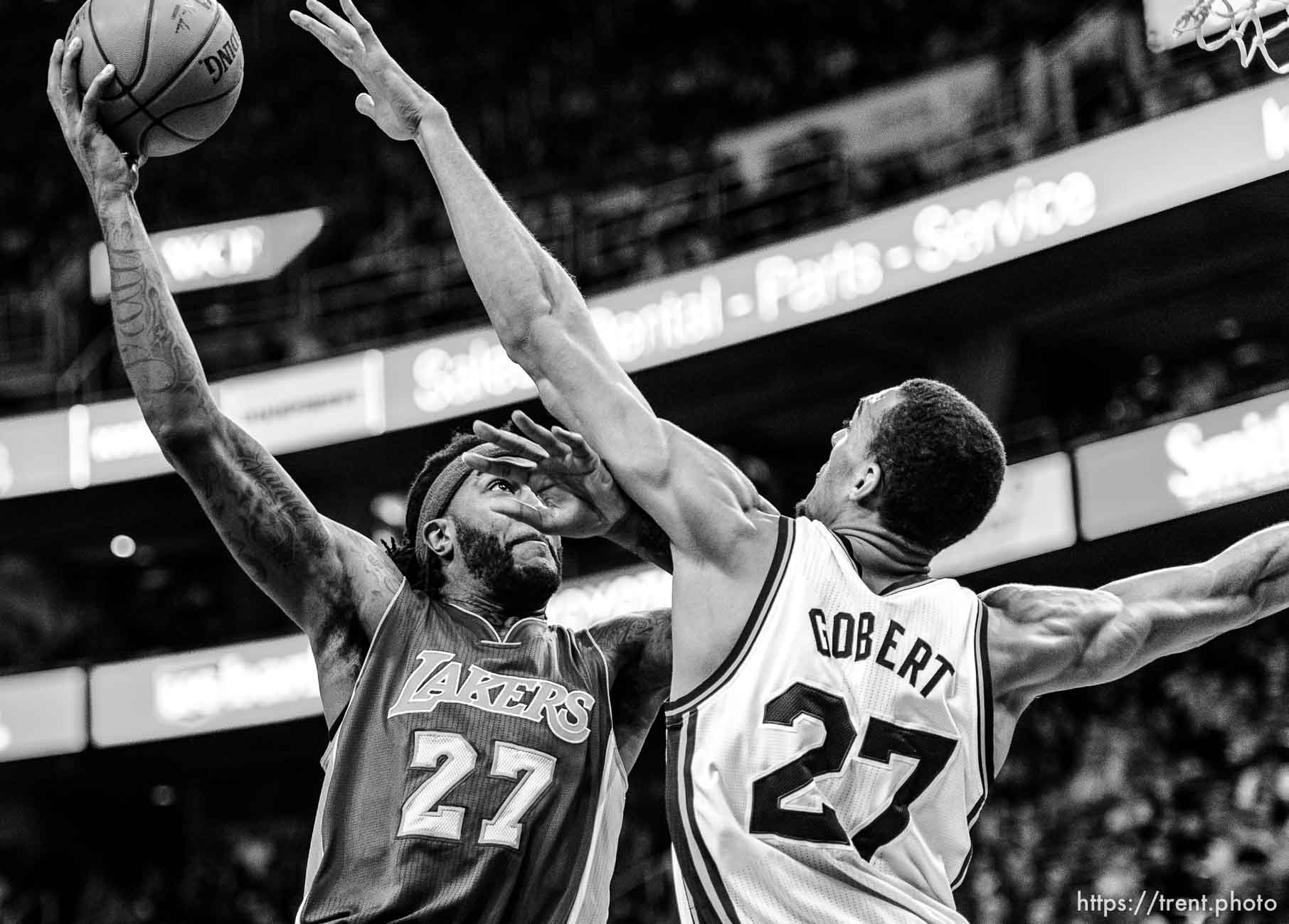 Los Angeles Lakers center Jordan Hill (27) shoots over Utah Jazz center Rudy Gobert (27) as the Utah Jazz host the Los Angeles Lakers at EnergySolutions Arena in Salt Lake City, Wednesday February 25, 2015.