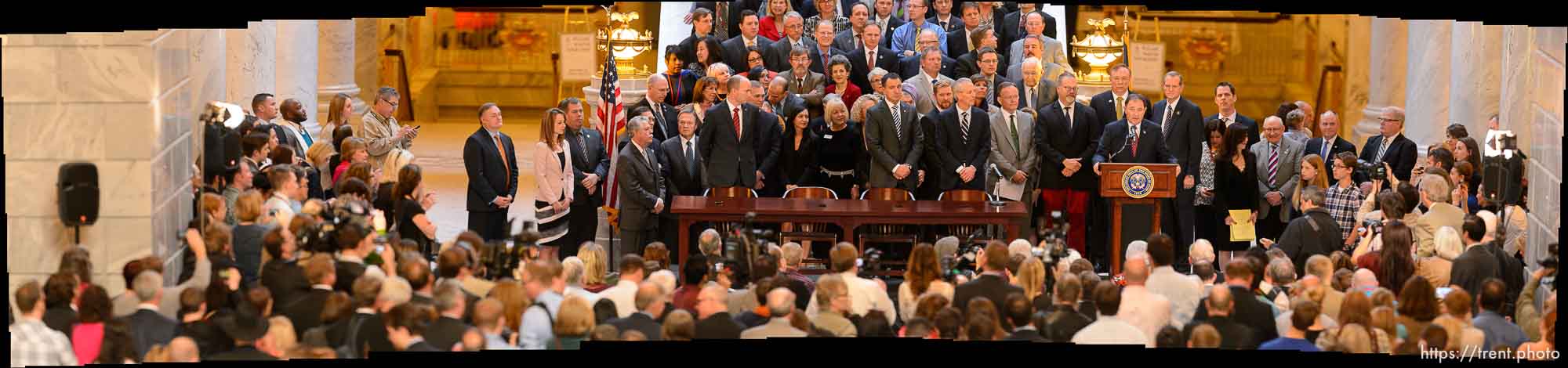 Gov. Gary Herbert signs into law SB296, which gives statewide non-discrimination protections to the gay and transgender community, while providing safeguards for religious liberty, in the rotunda of the State Capitol Building in Salt Lake City, Thursday March 12, 2015.