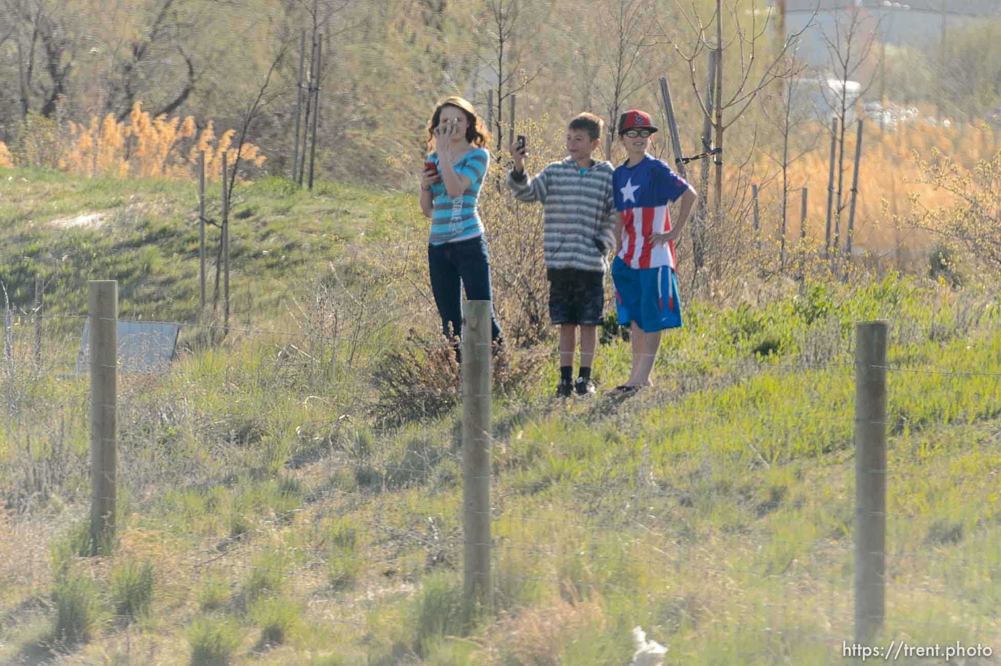 Trent Nelson  |  The Salt Lake Tribune
Onlookers line the route of President Barack Obama's motorcade as it makes its way from Salt Lake City to Hill Air Force Base, Friday April 3, 2015.