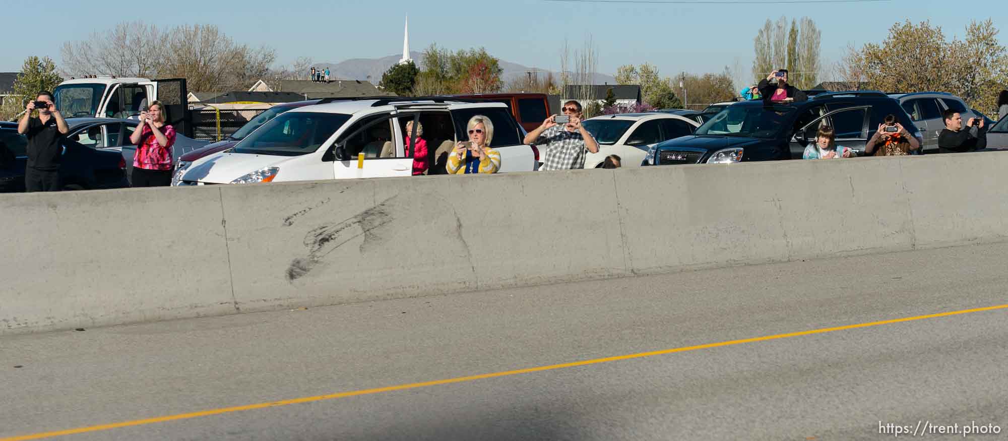 Trent Nelson  |  The Salt Lake Tribune
Onlookers line the route of President Barack Obama's motorcade as it makes its way from Salt Lake City to Hill Air Force Base, Friday April 3, 2015.