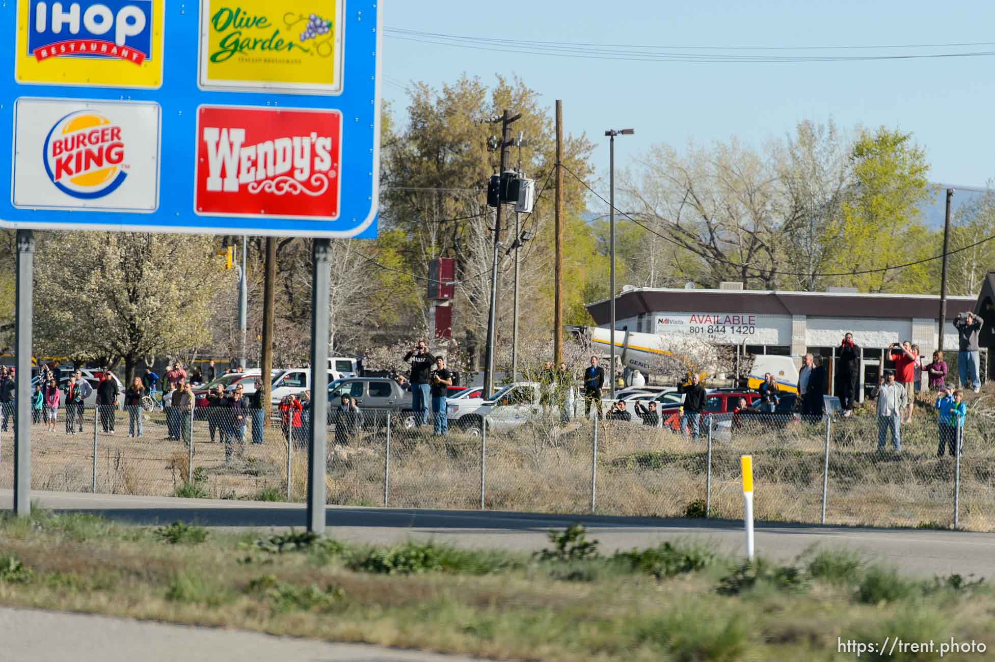 Trent Nelson  |  The Salt Lake Tribune
Onlookers line the route of President Barack Obama's motorcade as it makes its way from Salt Lake City to Hill Air Force Base, Friday April 3, 2015.