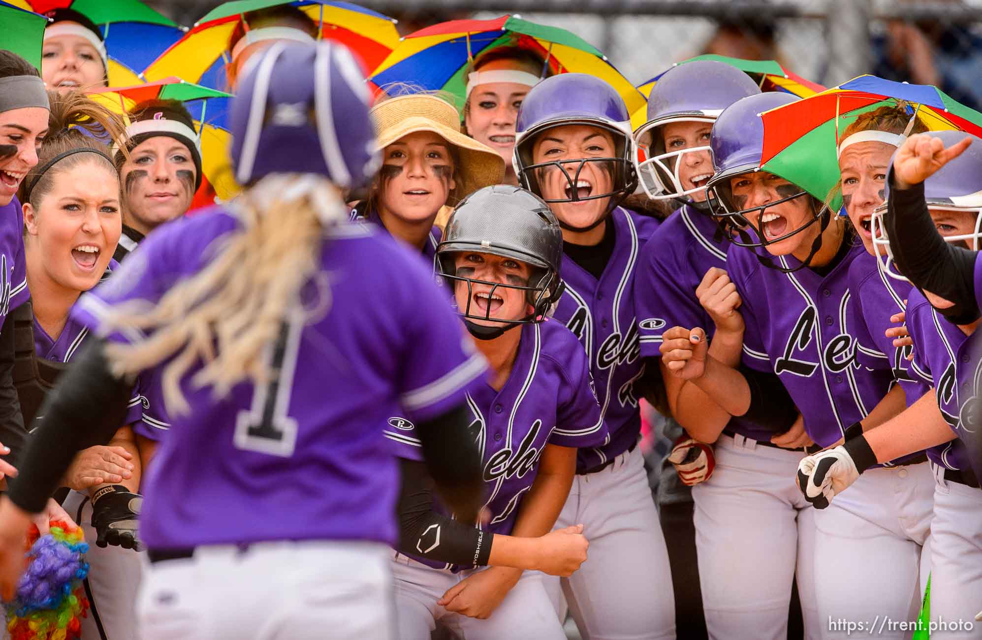 Trent Nelson  |  The Salt Lake Tribune
Lehi players celebrate as Stefani Zimmerman rounds the bases on a home run during a 5A softball tournament second-round game between defending champion Lehi and No. 1 seed Taylorsville, Thursday May 14, 2015.