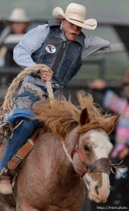 Trent Nelson  |  The Salt Lake Tribune
Nathan Urie competes in Saddle Bronc at the Utah High School Rodeo Association state championships in Heber, Saturday June 6, 2015.
