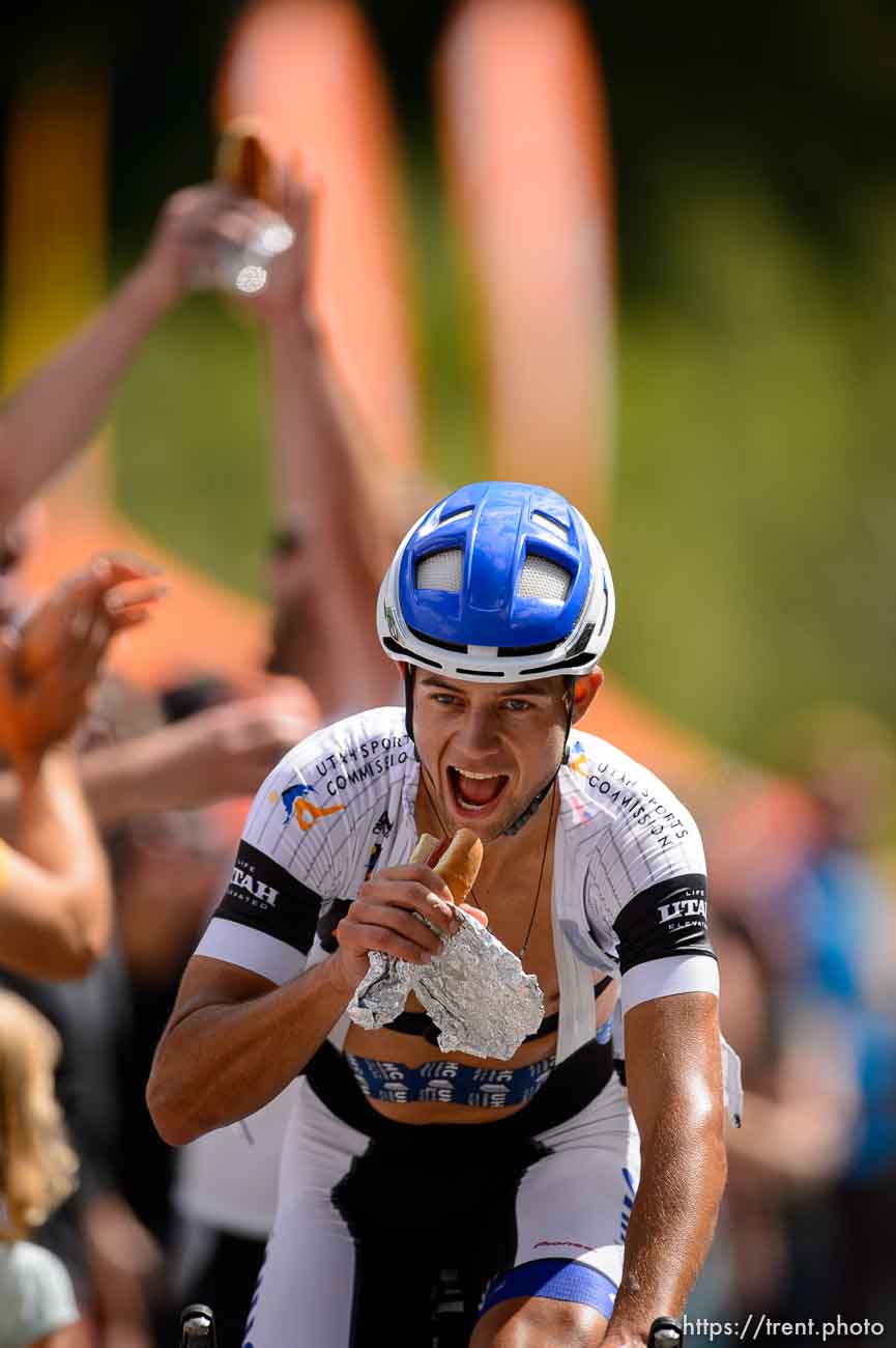 rider eating hot dog, Tour of Utah at Tanners Flat, Little Cottonwood Canyon , Saturday August 8, 2015.