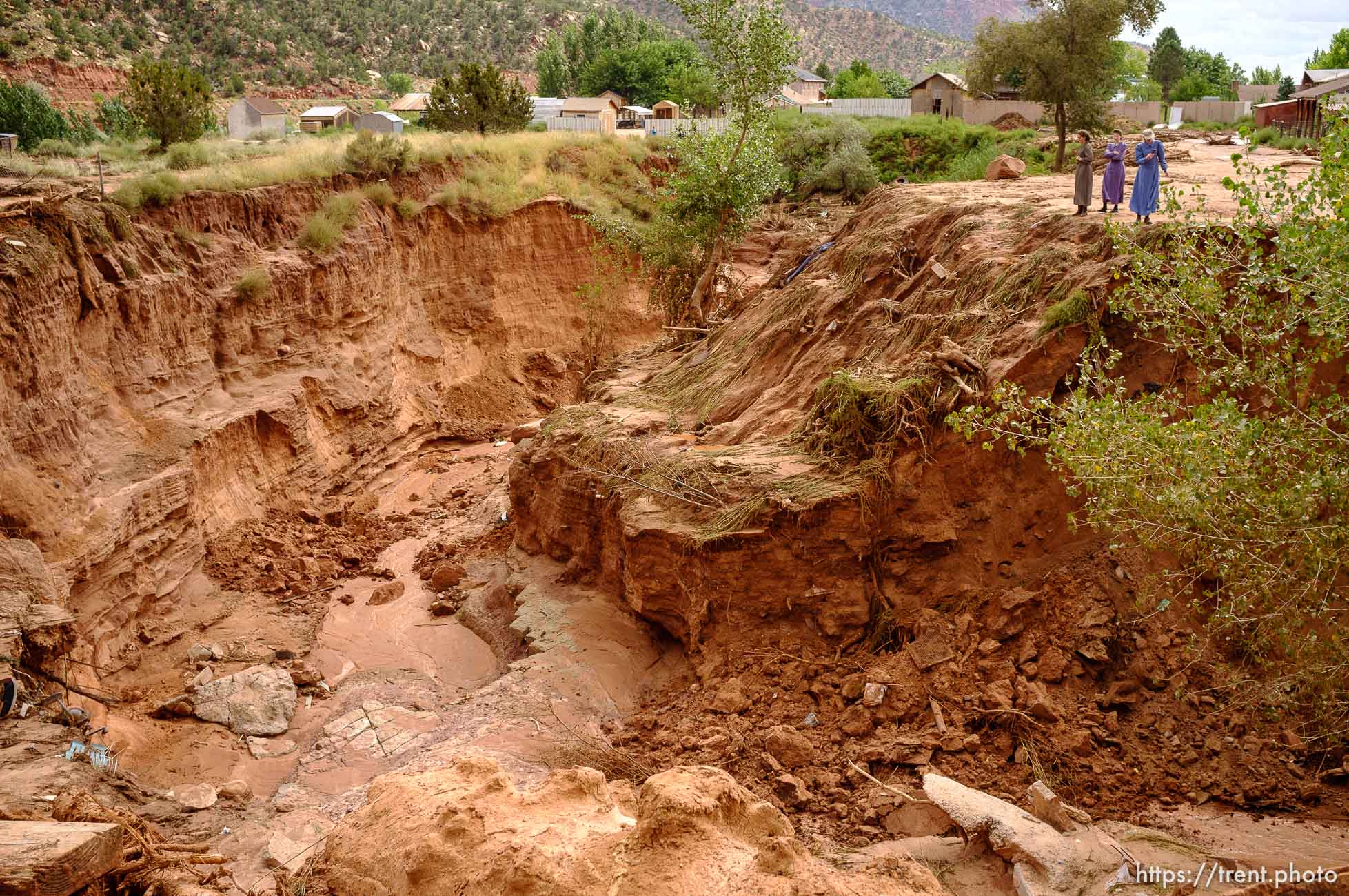 Trent Nelson  |  The Salt Lake Tribune
People take in the scene in a Hildale wash where a flash flood killed nine people (with four still missing) Tuesday September 15, 2015., the day after an SUV and a van were washed off a road during a flash flood in this polygamous Utah-Arizona border community.