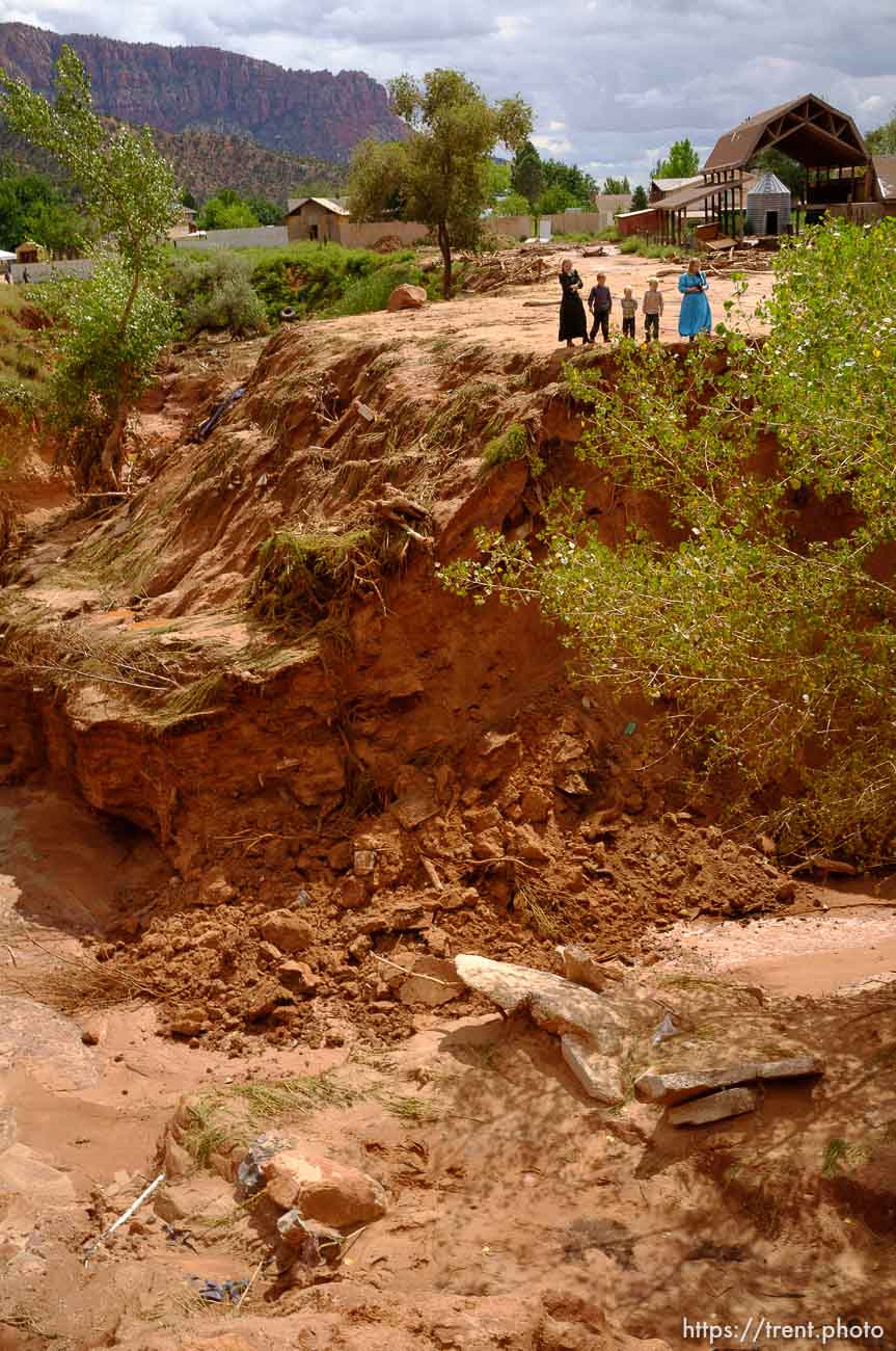 Trent Nelson  |  The Salt Lake Tribune
People take in the scene in a Hildale wash where a flash flood killed nine people (with four still missing) Tuesday September 15, 2015., the day after an SUV and a van were washed off a road during a flash flood in this polygamous Utah-Arizona border community.