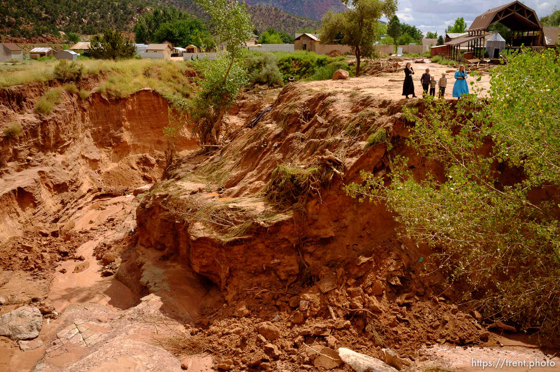 Trent Nelson  |  The Salt Lake Tribune
People take in the scene in a Hildale wash where a flash flood killed nine people (with four still missing) Tuesday September 15, 2015., the day after an SUV and a van were washed off a road during a flash flood in this polygamous Utah-Arizona border community.