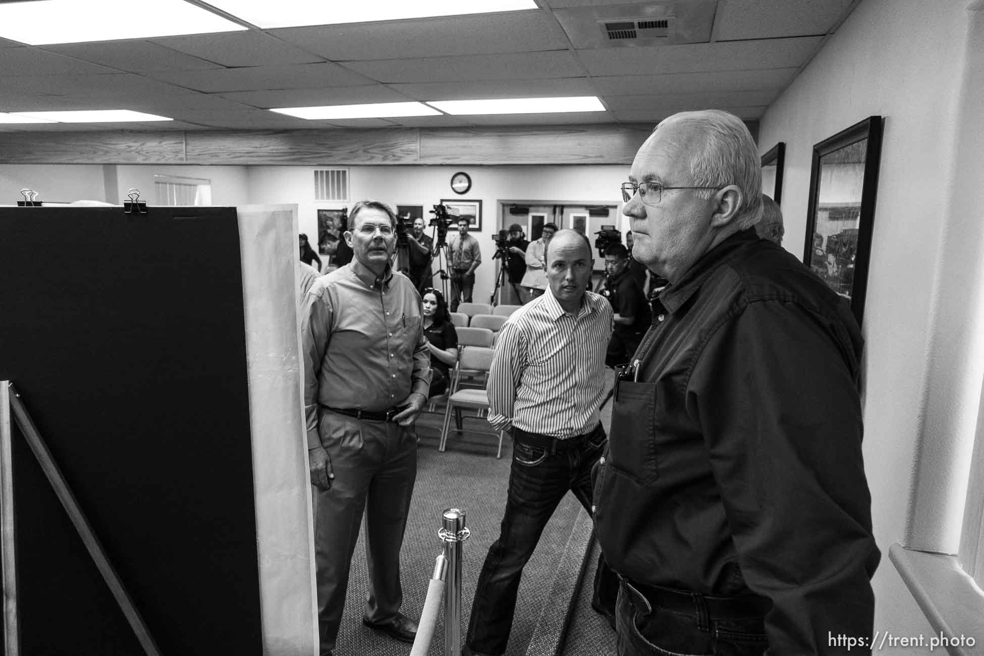 Trent Nelson  |  The Salt Lake Tribune
Hildale Mayor Philip Barlow, Lt. Governor Spencer Cox, flash flood press conference at colorado city hall,  Tuesday September 15, 2015.
Eight people had died and five remained missing Tuesday morning, the day after an SUV and a van were washed off a road during a flash flood in this polygamous Utah-Arizona border community