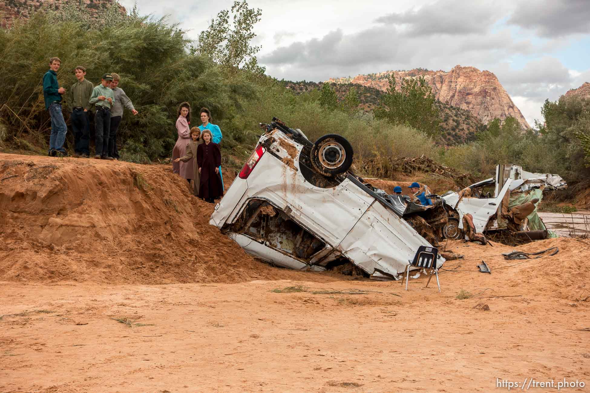 Trent Nelson  |  The Salt Lake Tribune
People at the spot in a Hildale wash Tuesday September 15, 2015 where two vehicles ended up after being washed away in a flash flood. Nine people died (with four still missing) when the SUV and van were washed off a road during a flash flood in this polygamous Utah-Arizona border community.