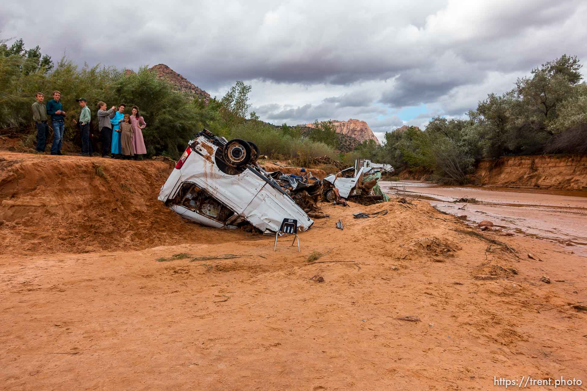 Trent Nelson  |  The Salt Lake Tribune
People at the spot in a Hildale wash Tuesday September 15, 2015 where two vehicles ended up after being washed away in a flash flood. Nine people died (with four still missing) when the SUV and van were washed off a road during a flash flood in this polygamous Utah-Arizona border community.