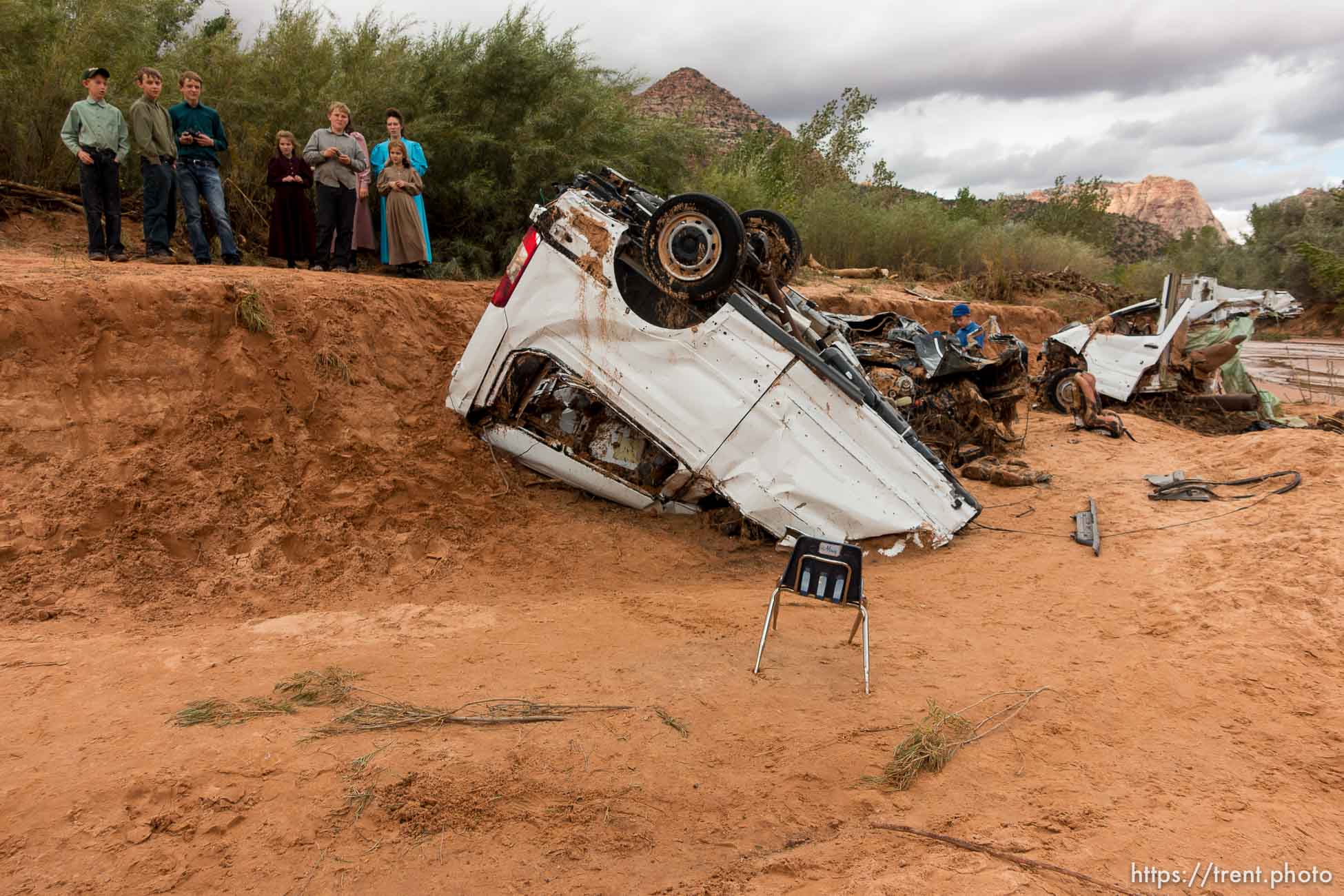 Trent Nelson  |  The Salt Lake Tribune
People at the spot in a Hildale wash Tuesday September 15, 2015 where two vehicles ended up after being washed away in a flash flood. Nine people died (with four still missing) when the SUV and van were washed off a road during a flash flood in this polygamous Utah-Arizona border community.