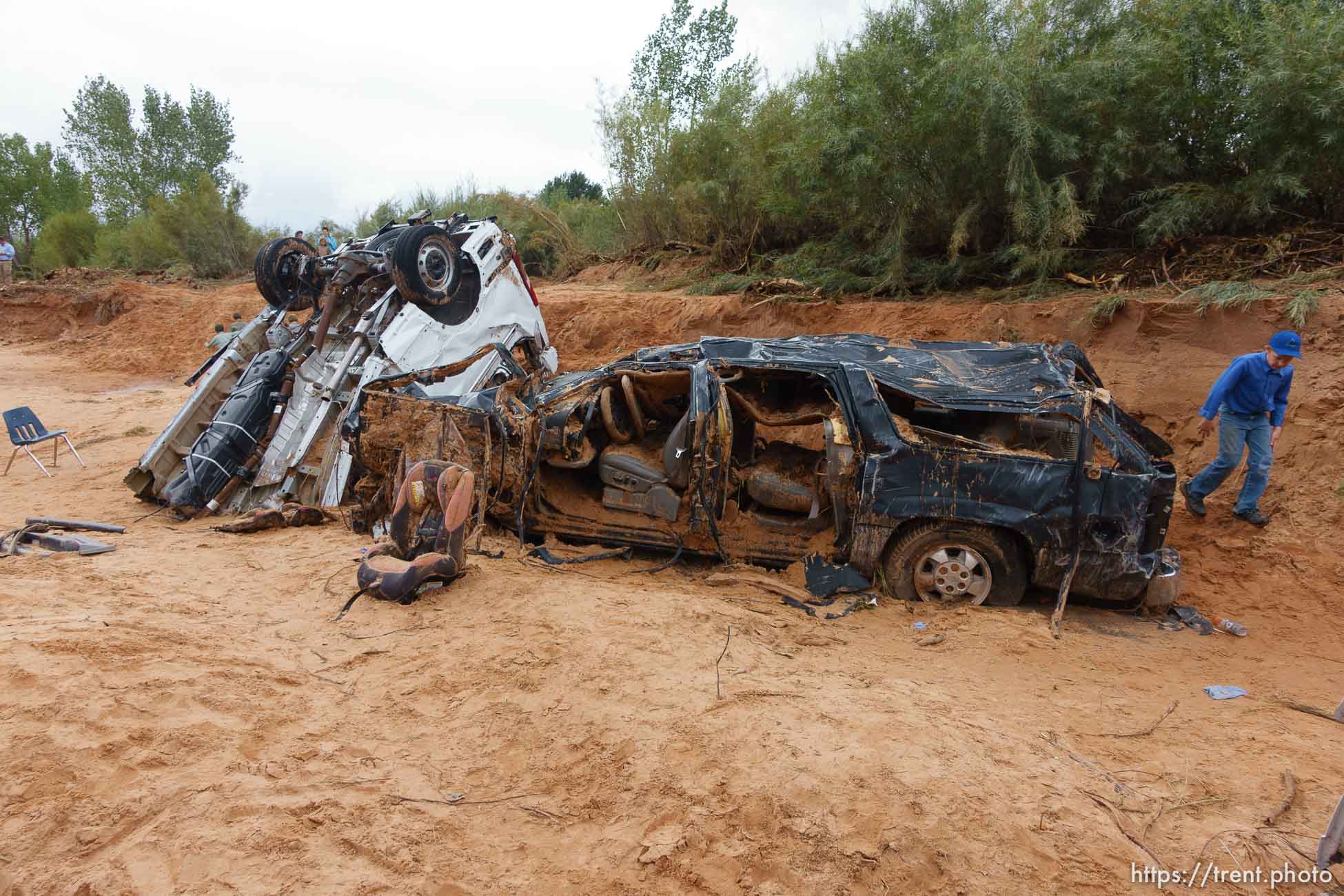 Trent Nelson  |  The Salt Lake Tribune
People at the spot in a Hildale wash Tuesday September 15, 2015 where two vehicles ended up after being washed away in a flash flood. Nine people died (with four still missing) when the SUV and van were washed off a road during a flash flood in this polygamous Utah-Arizona border community.