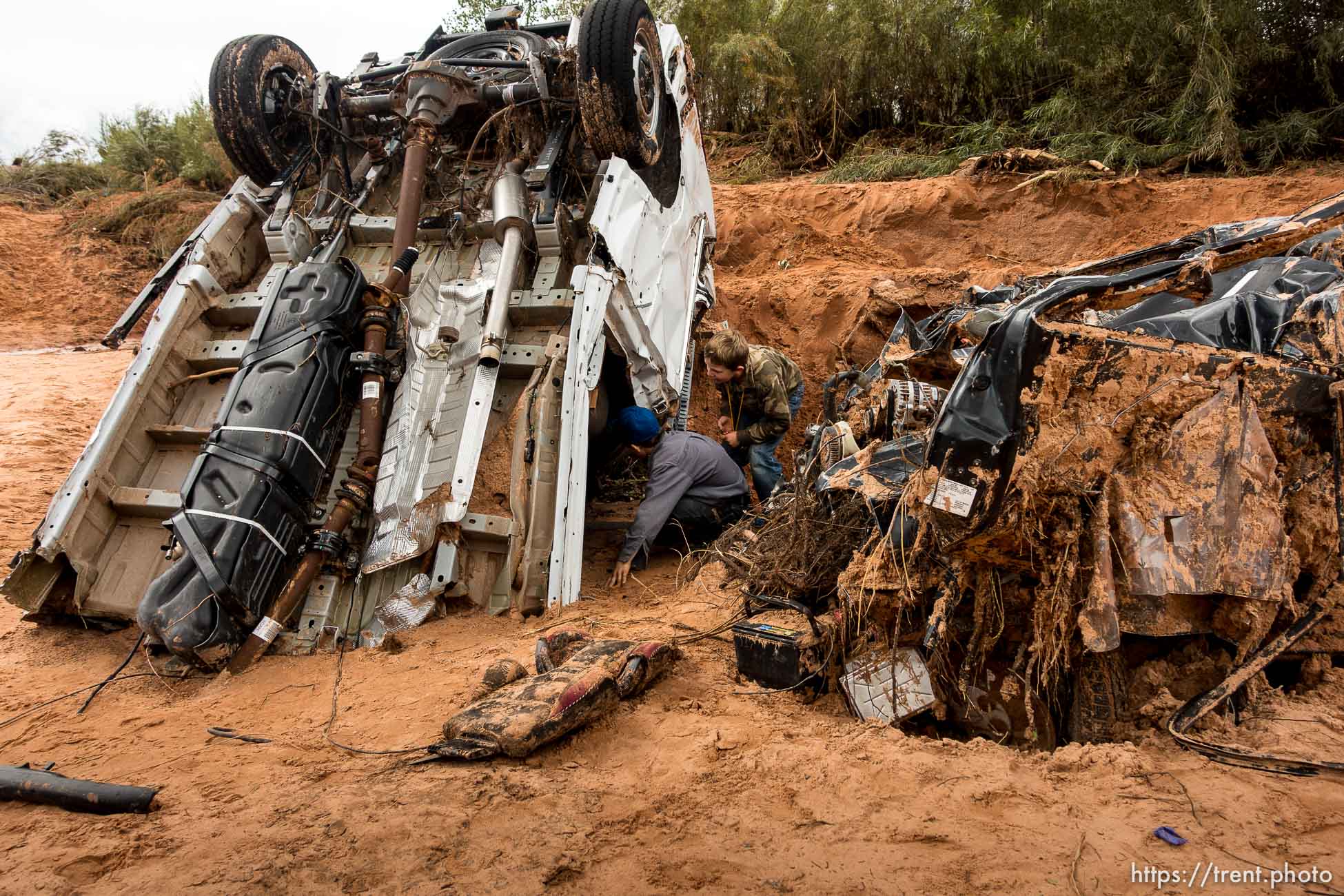 Trent Nelson  |  The Salt Lake Tribune
People at the spot in a Hildale wash Tuesday September 15, 2015 where two vehicles ended up after being washed away in a flash flood. Nine people died (with four still missing) when the SUV and van were washed off a road during a flash flood in this polygamous Utah-Arizona border community.