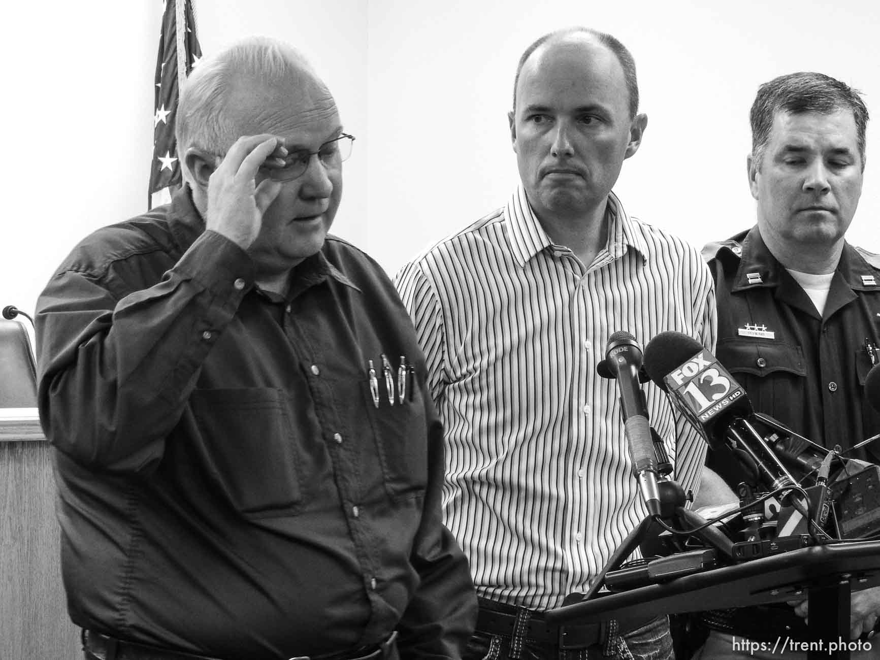 Trent Nelson  |  The Salt Lake Tribune
Hildale Mayor Philip Barlow, left, speaks with Utah Lt. Governor Spencer Cox at right, after nine people were killed and five remained missing Tuesday morning, the day after an SUV and a van were washed off a road during a flash flood in this polygamous Utah-Arizona border community.