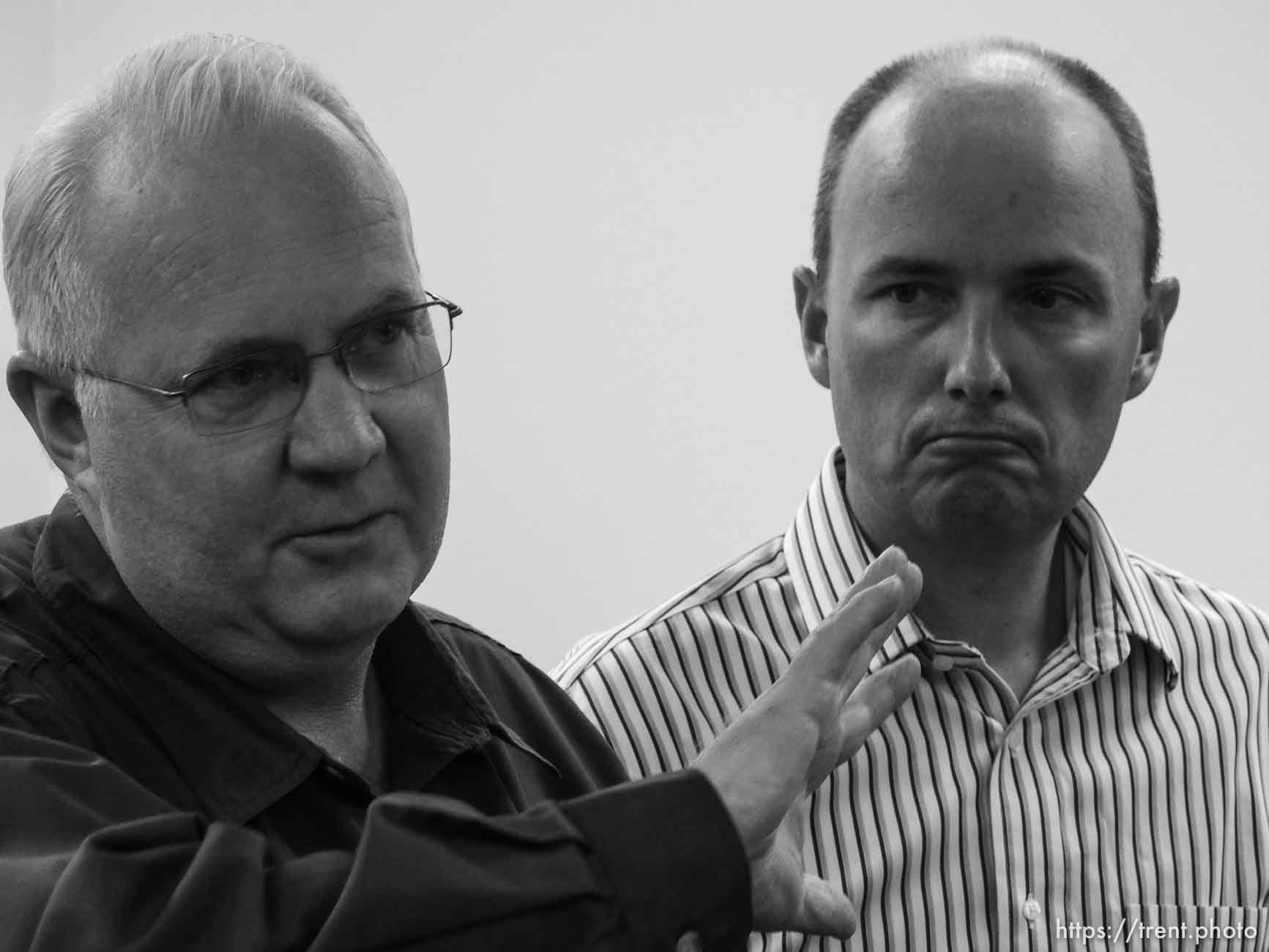 Trent Nelson  |  The Salt Lake Tribune
Hildale Mayor Philip Barlow, left, speaks with Utah Lt. Governor Spencer Cox at right, after nine people were killed and five remained missing Tuesday morning, the day after an SUV and a van were washed off a road during a flash flood in this polygamous Utah-Arizona border community.