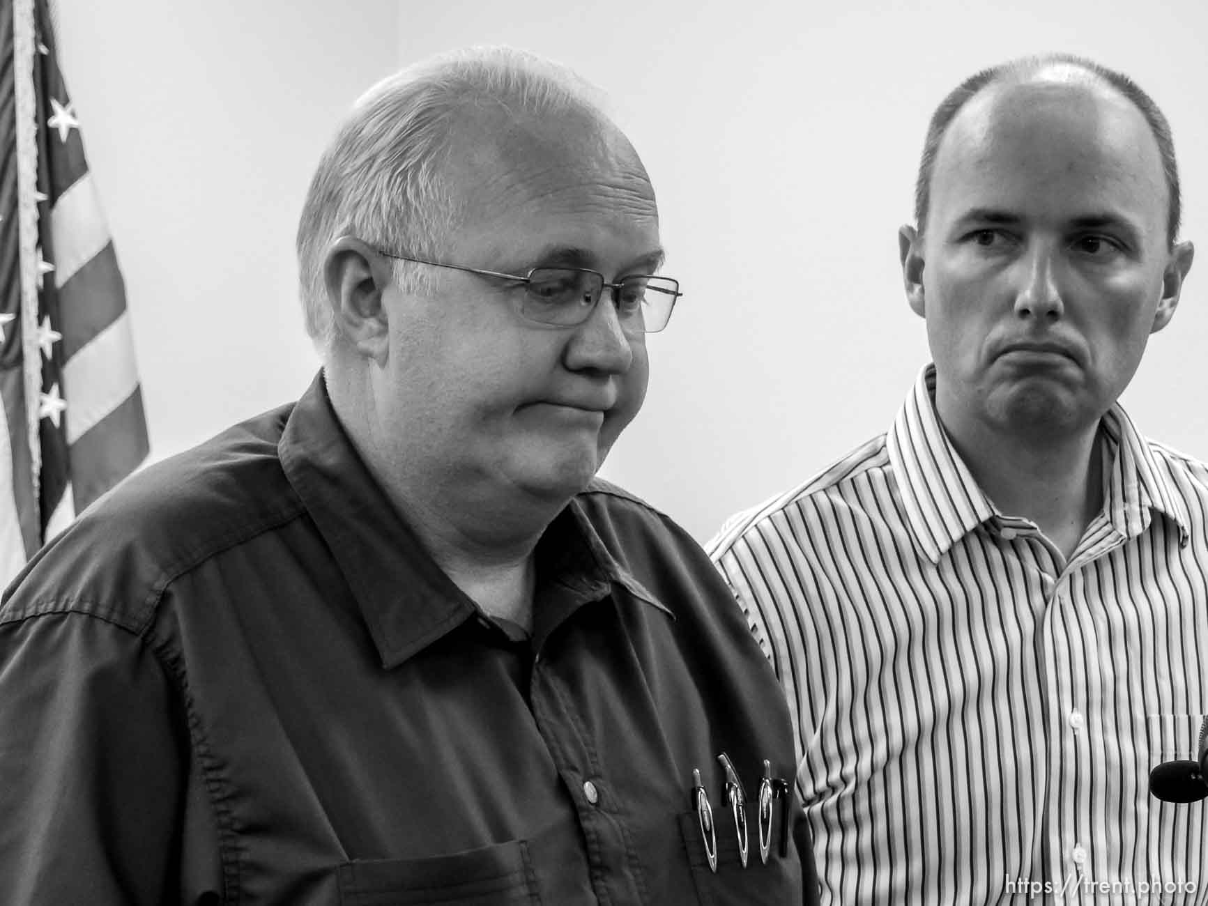 Trent Nelson  |  The Salt Lake Tribune
Hildale Mayor Philip Barlow, left, speaks with Utah Lt. Governor Spencer Cox at right, after nine people were killed and five remained missing Tuesday morning, the day after an SUV and a van were washed off a road during a flash flood in this polygamous Utah-Arizona border community.