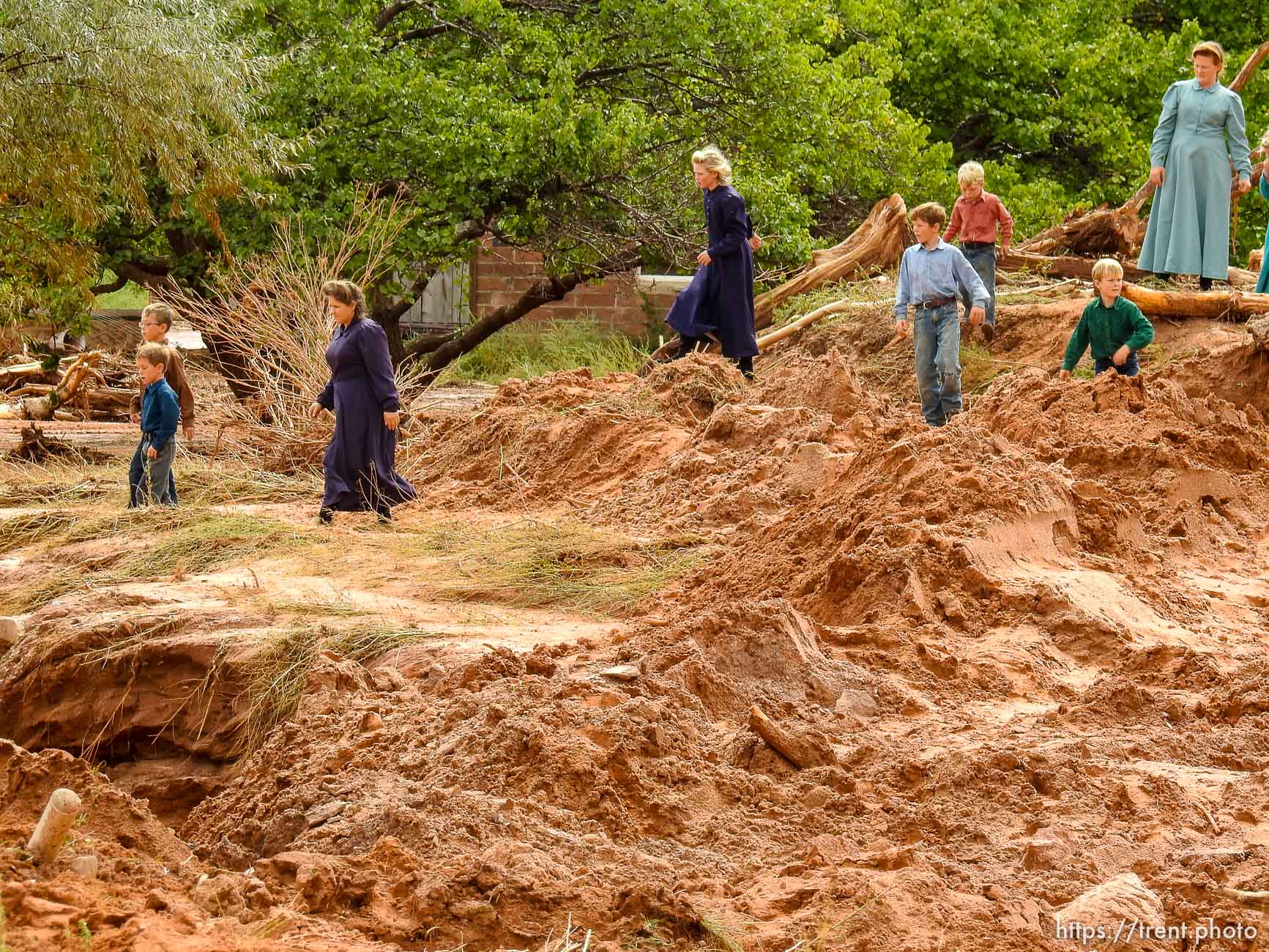 Trent Nelson  |  The Salt Lake Tribune
People take in the scene in a Hildale wash where a flash flood killed nine people (with four still missing) Tuesday September 15, 2015., the day after an SUV and a van were washed off a road during a flash flood in this polygamous Utah-Arizona border community.