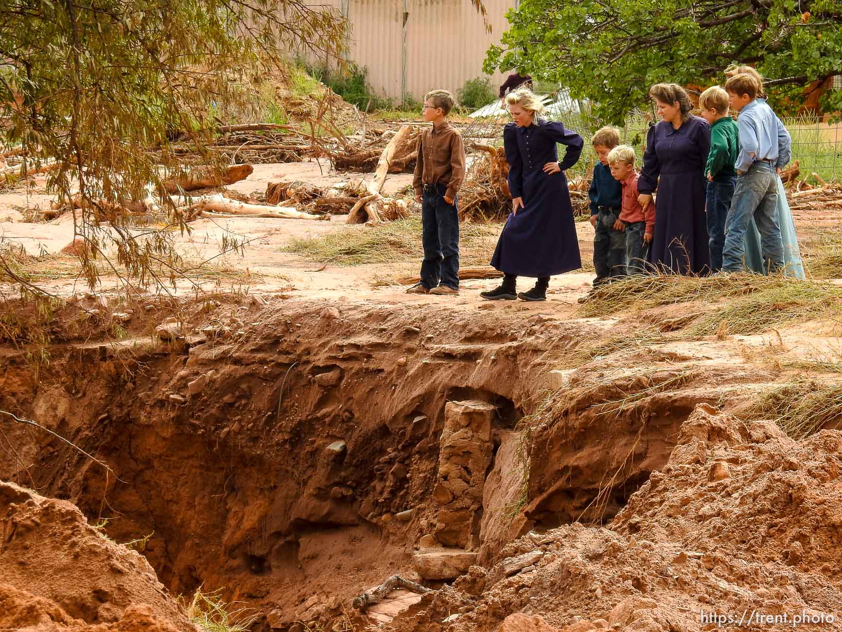 Trent Nelson  |  The Salt Lake Tribune
People take in the scene in a Hildale wash where a flash flood killed nine people (with four still missing) Tuesday September 15, 2015., the day after an SUV and a van were washed off a road during a flash flood in this polygamous Utah-Arizona border community.