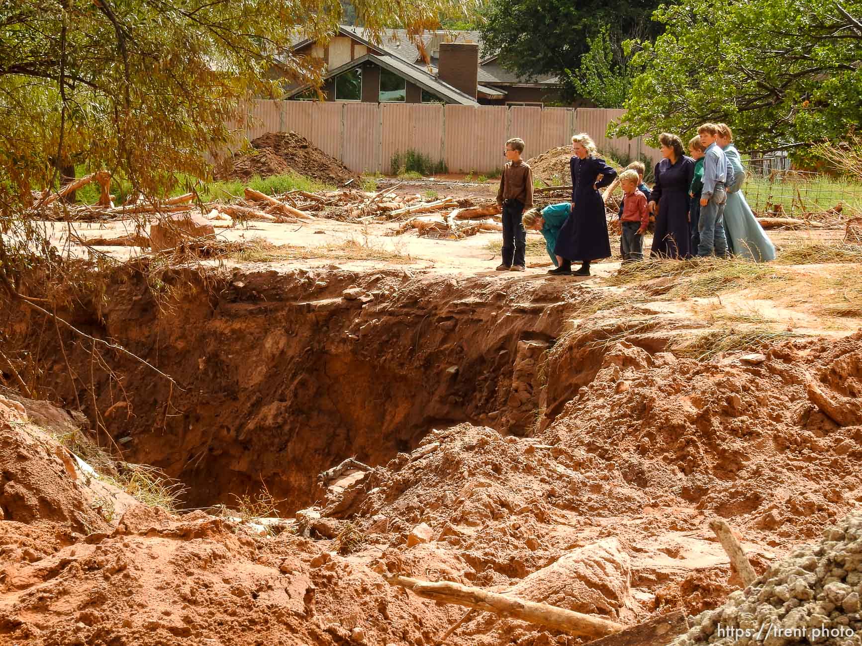 Trent Nelson  |  The Salt Lake Tribune
People take in the scene in a Hildale wash where a flash flood killed nine people (with four still missing) Tuesday September 15, 2015., the day after an SUV and a van were washed off a road during a flash flood in this polygamous Utah-Arizona border community.