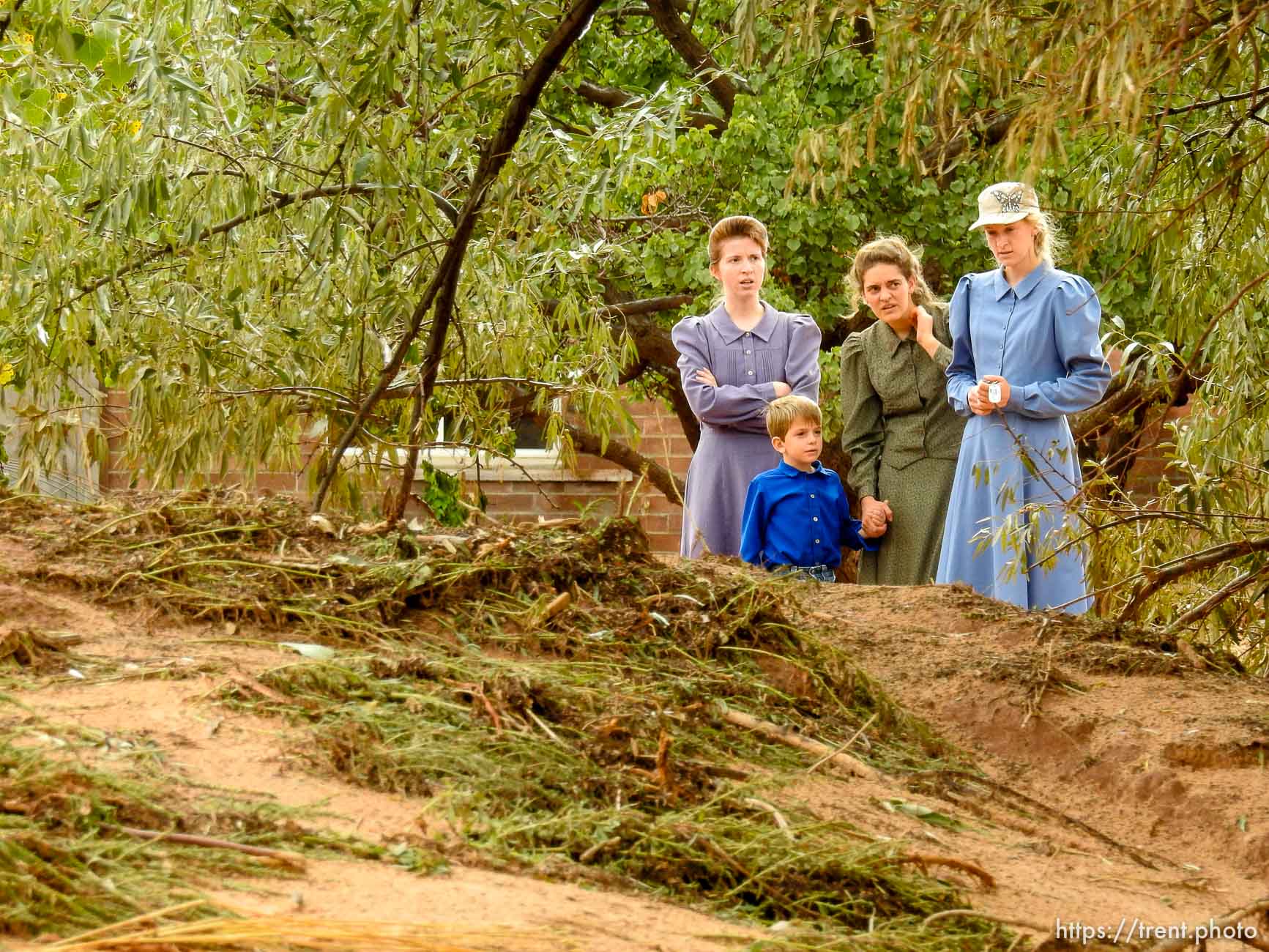 Trent Nelson  |  The Salt Lake Tribune
People take in the scene in a Hildale wash where a flash flood killed nine people (with four still missing) Tuesday September 15, 2015., the day after an SUV and a van were washed off a road during a flash flood in this polygamous Utah-Arizona border community.