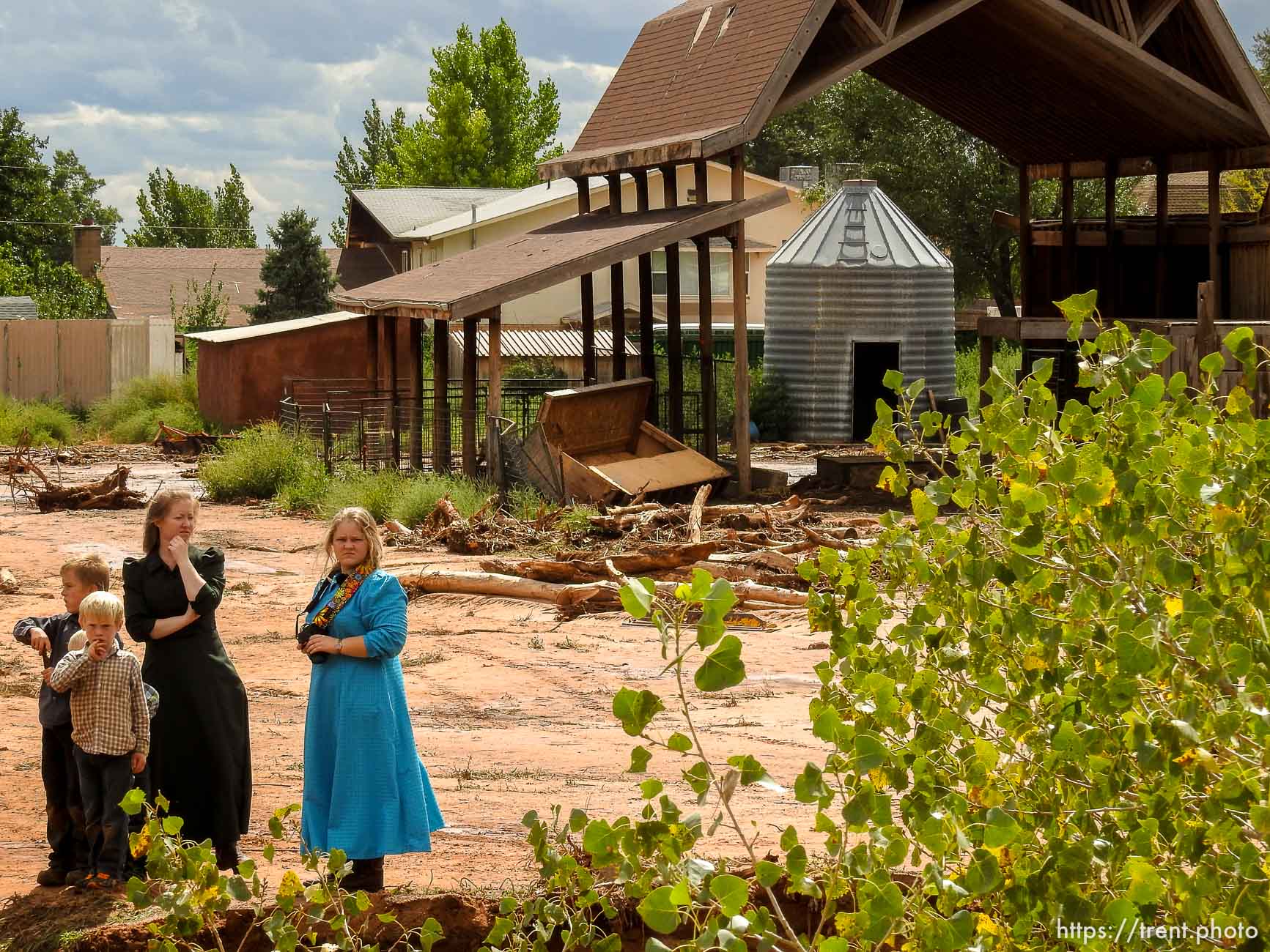 Trent Nelson  |  The Salt Lake Tribune
People take in the scene in a Hildale wash where a flash flood killed nine people (with four still missing) Tuesday September 15, 2015., the day after an SUV and a van were washed off a road during a flash flood in this polygamous Utah-Arizona border community.