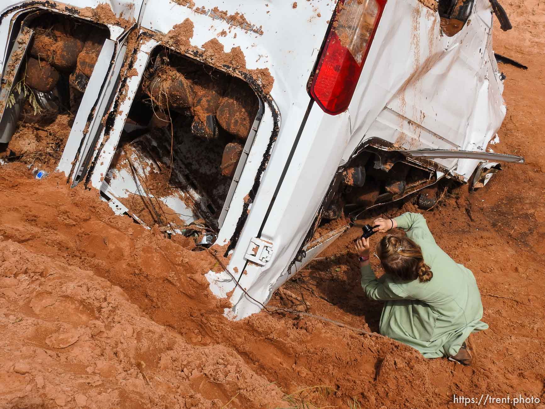 Trent Nelson  |  The Salt Lake Tribune
People take in the scene in a Hildale wash where a flash flood killed nine people (with four still missing) Tuesday September 15, 2015., the day after an SUV and a van were washed off a road during a flash flood in this polygamous Utah-Arizona border community.