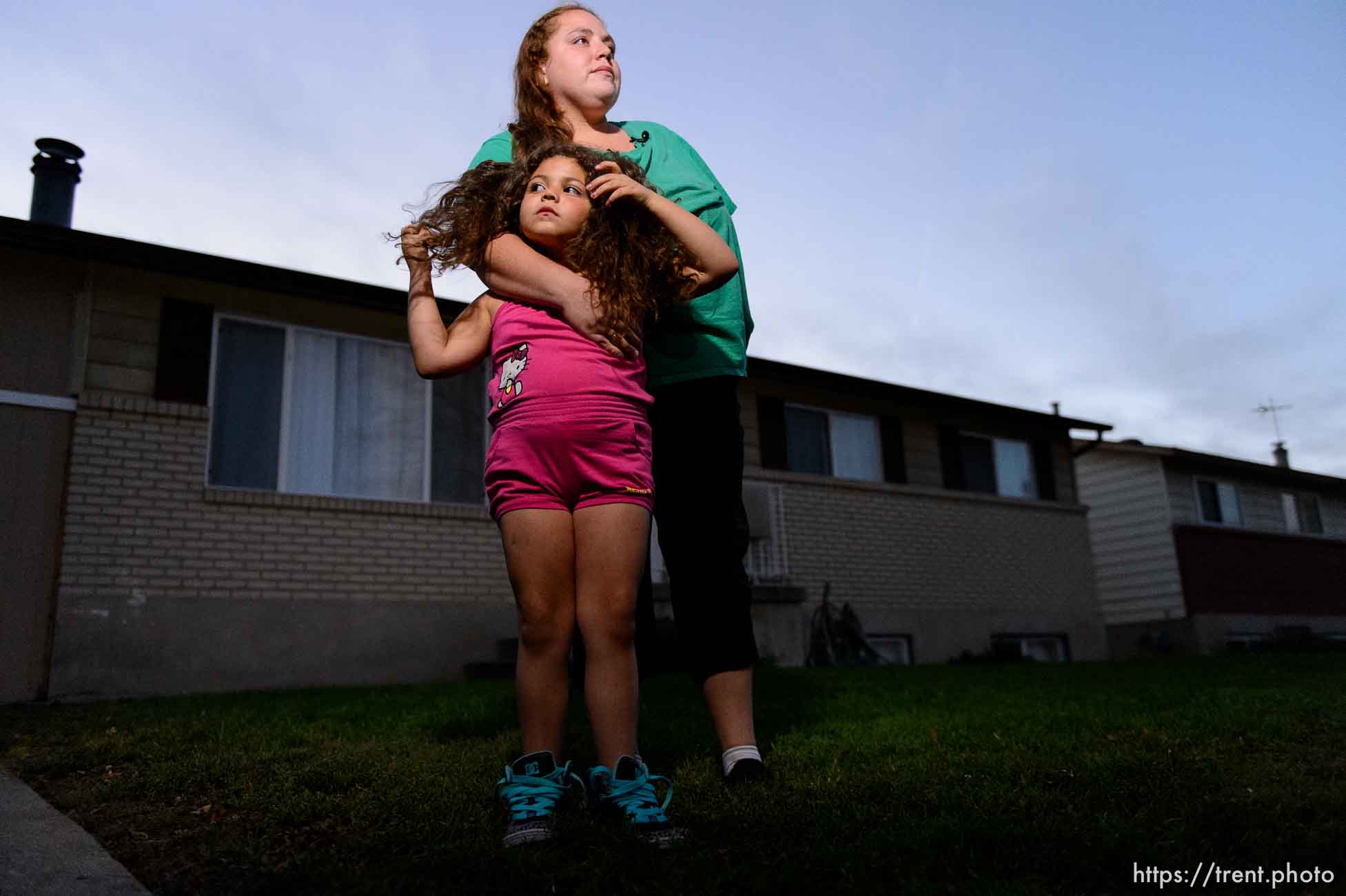 Trent Nelson  |  The Salt Lake Tribune
Kristen Morales, a friend of the Poike family, embraces Tayzia Cordova during an informal vigil for three homicide victims in Salt Lake City, Saturday September 19, 2015. Two of the three people found dead in the northwest Salt Lake City home were identified as Heike Poike, 50, and her 2-month-old granddaughter, Lyrik Poike. The male victim has not been identified.