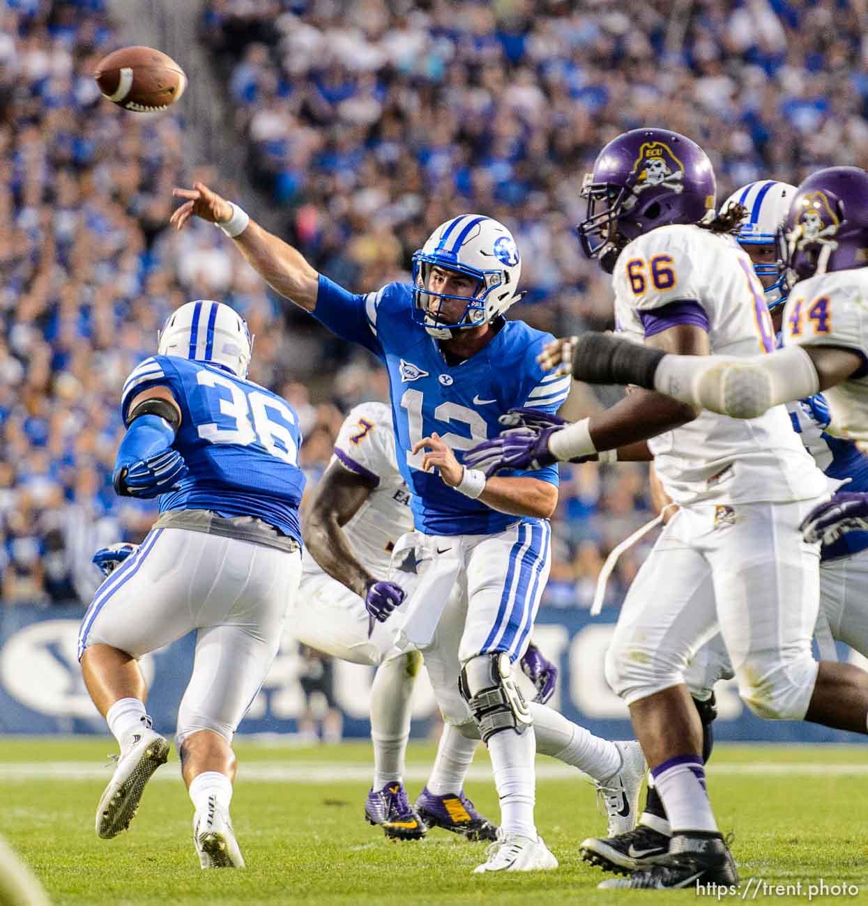 Trent Nelson  |  The Salt Lake Tribune
Brigham Young Cougars quarterback Tanner Mangum (12) passes to Brigham Young Cougars wide receiver Terenn Houk (11) for a first half touchdown as BYU hosts East Carolina, college football at LaVell Edwards Stadium in Provo, Saturday October 10, 2015.