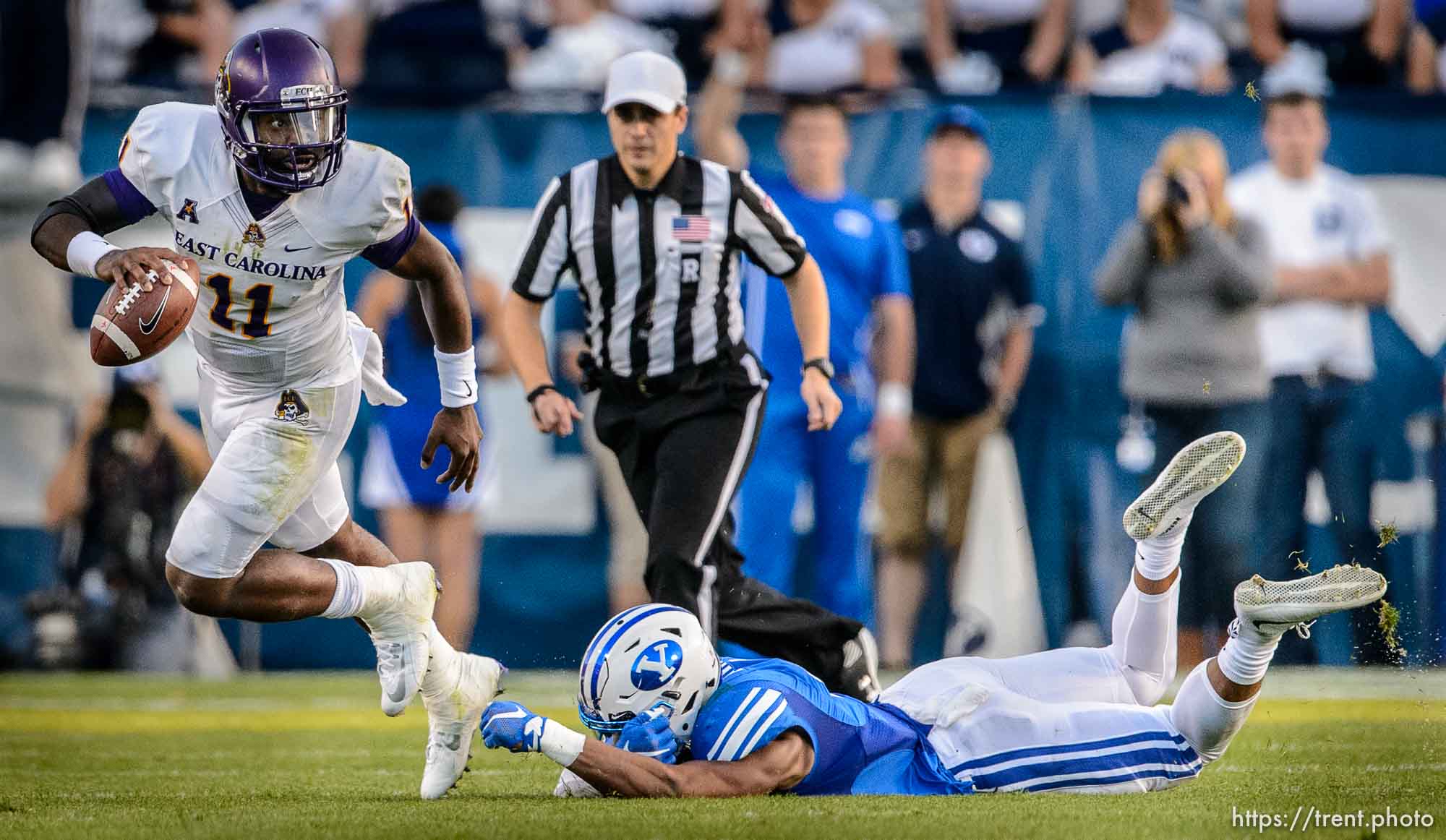 Trent Nelson  |  The Salt Lake Tribune
East Carolina Quarterback Cody Keith scrambles away from Brigham Young Cougars linebacker Fred Warner (4) as BYU hosts East Carolina, college football at LaVell Edwards Stadium in Provo, Saturday October 10, 2015.