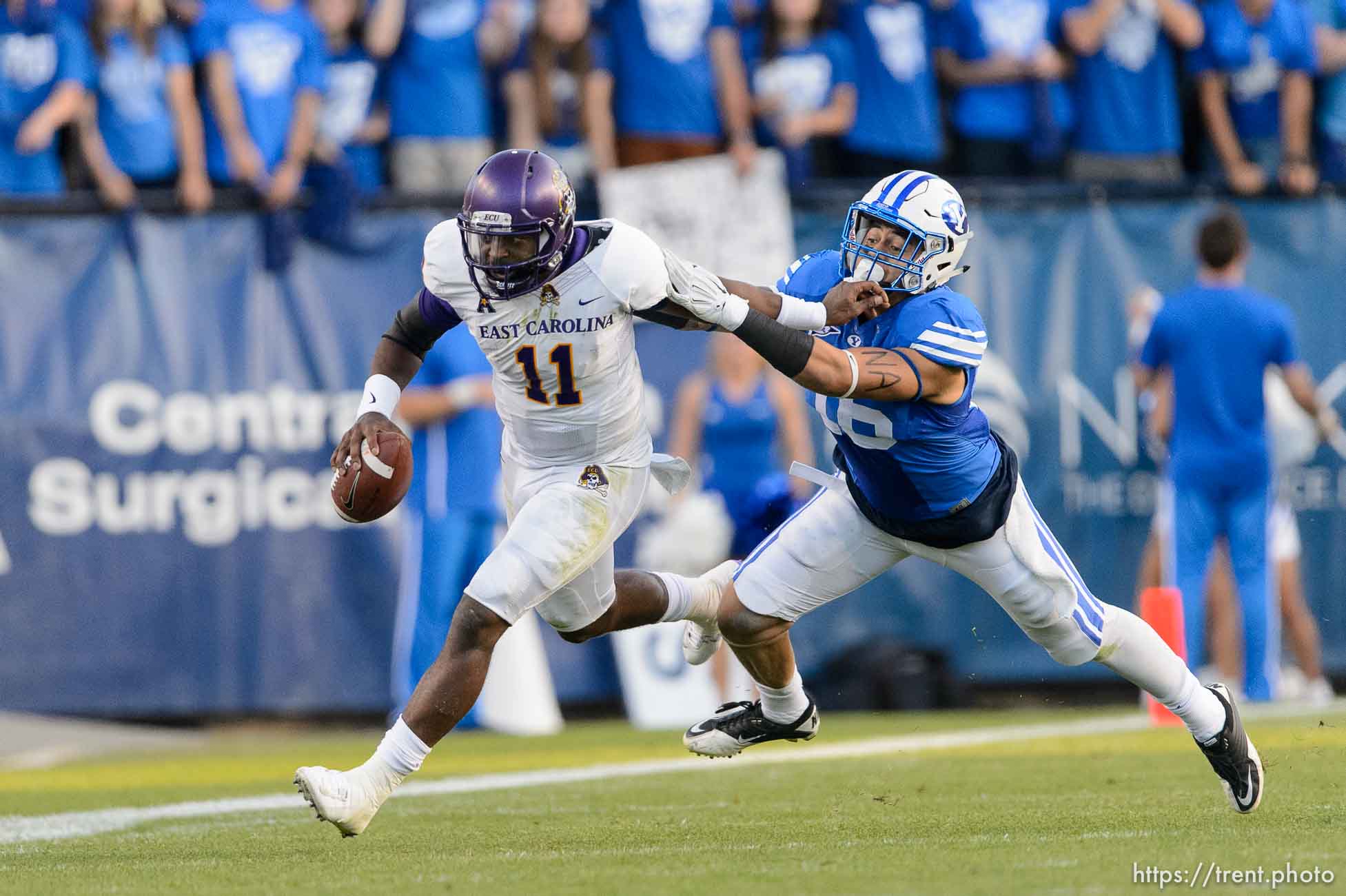 Trent Nelson  |  The Salt Lake Tribune
East Carolina Quarterback Cody Keith scrambles away from Brigham Young Cougars linebacker Sione Takitaki (16) as BYU hosts East Carolina, college football at LaVell Edwards Stadium in Provo, Saturday October 10, 2015.