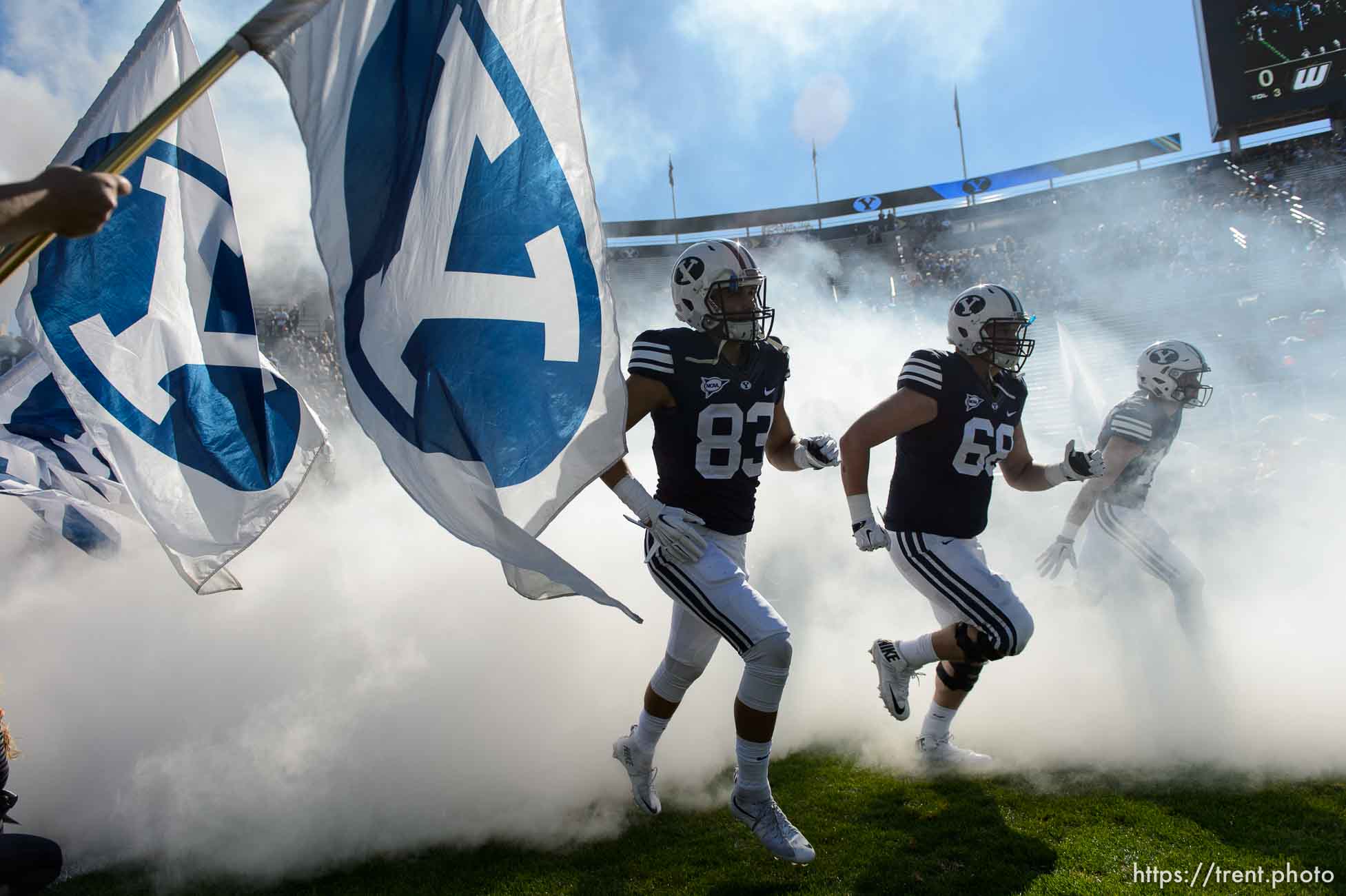 Trent Nelson  |  The Salt Lake Tribune
cougars take field through fog and flags as BYU hosts Wagner, NCAA football at LaVell Edwards Stadium in Provo, Saturday October 24, 2015.