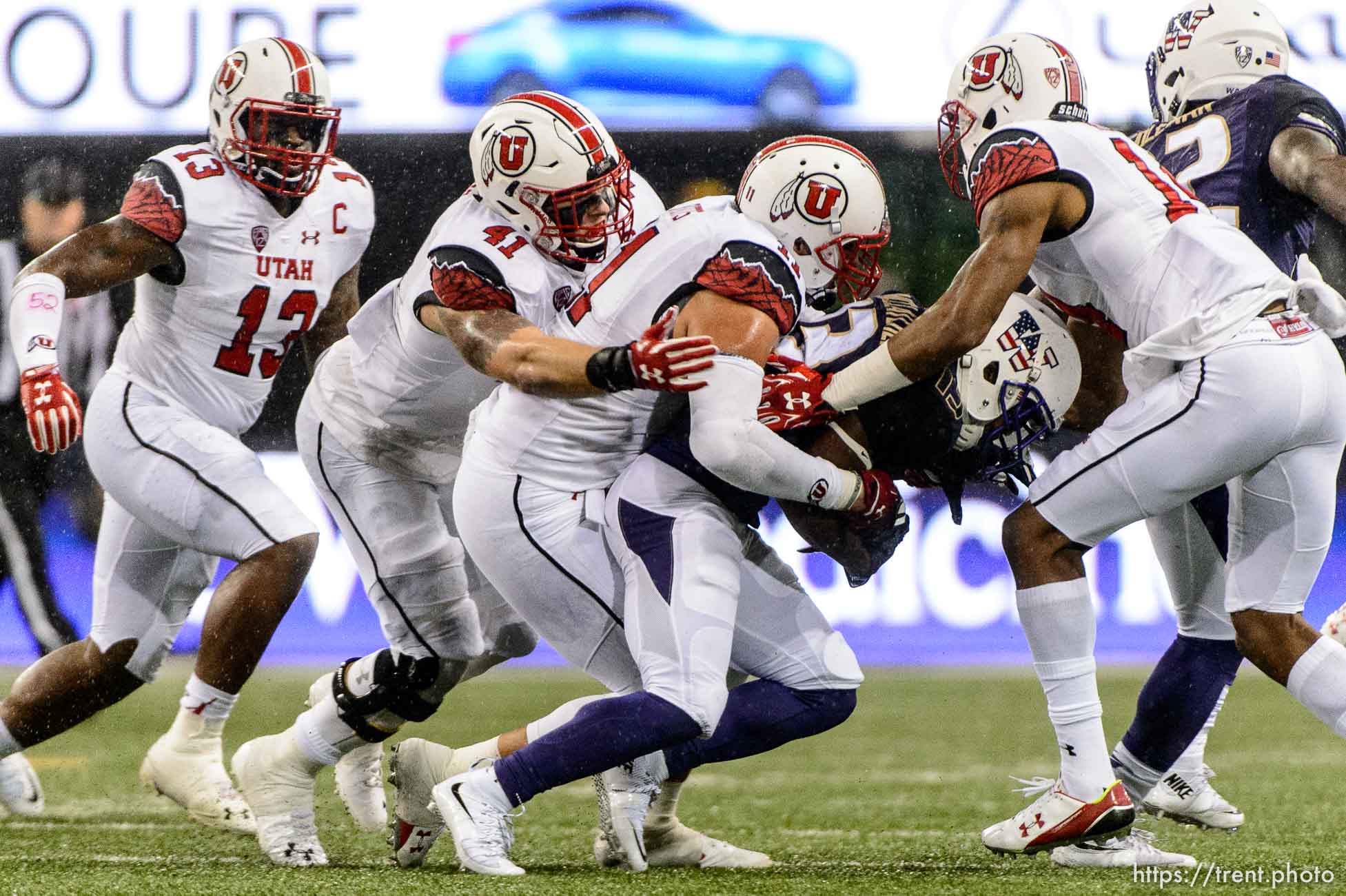 Trent Nelson  |  The Salt Lake Tribune
Utah defenders bring down Washington Huskies wide receiver Chico McClatcher (13) as the University of Utah faces the University of Washington, NCAA football at Husky Stadium in Seattle, Saturday November 7, 2015. From left, Utah Utes linebacker Gionni Paul (13), Utah Utes linebacker Jared Norris (41), Utah Utes defensive end Kylie Fitts (11), McClatcher, Utah Utes defensive back Brian Allen (14).