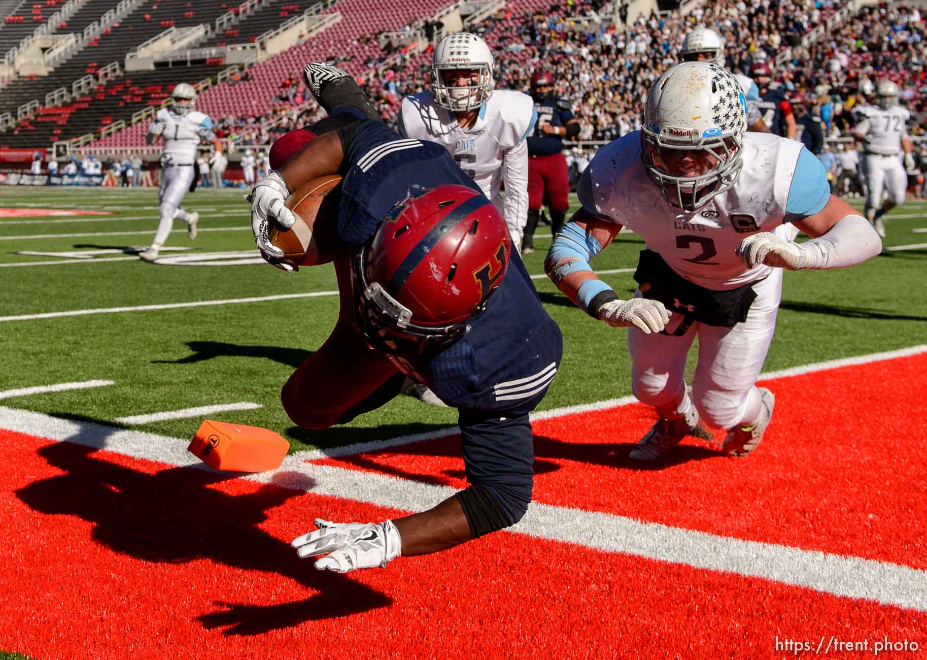 Trent Nelson  |  The Salt Lake Tribune
Herriman's Jake Jutkins (26) dives into the end zone for a touchdown, as Sky View faces Herriman in a 5A high school football semifinal game at Rice-Eccles Stadium in Salt Lake City, Friday November 13, 2015.