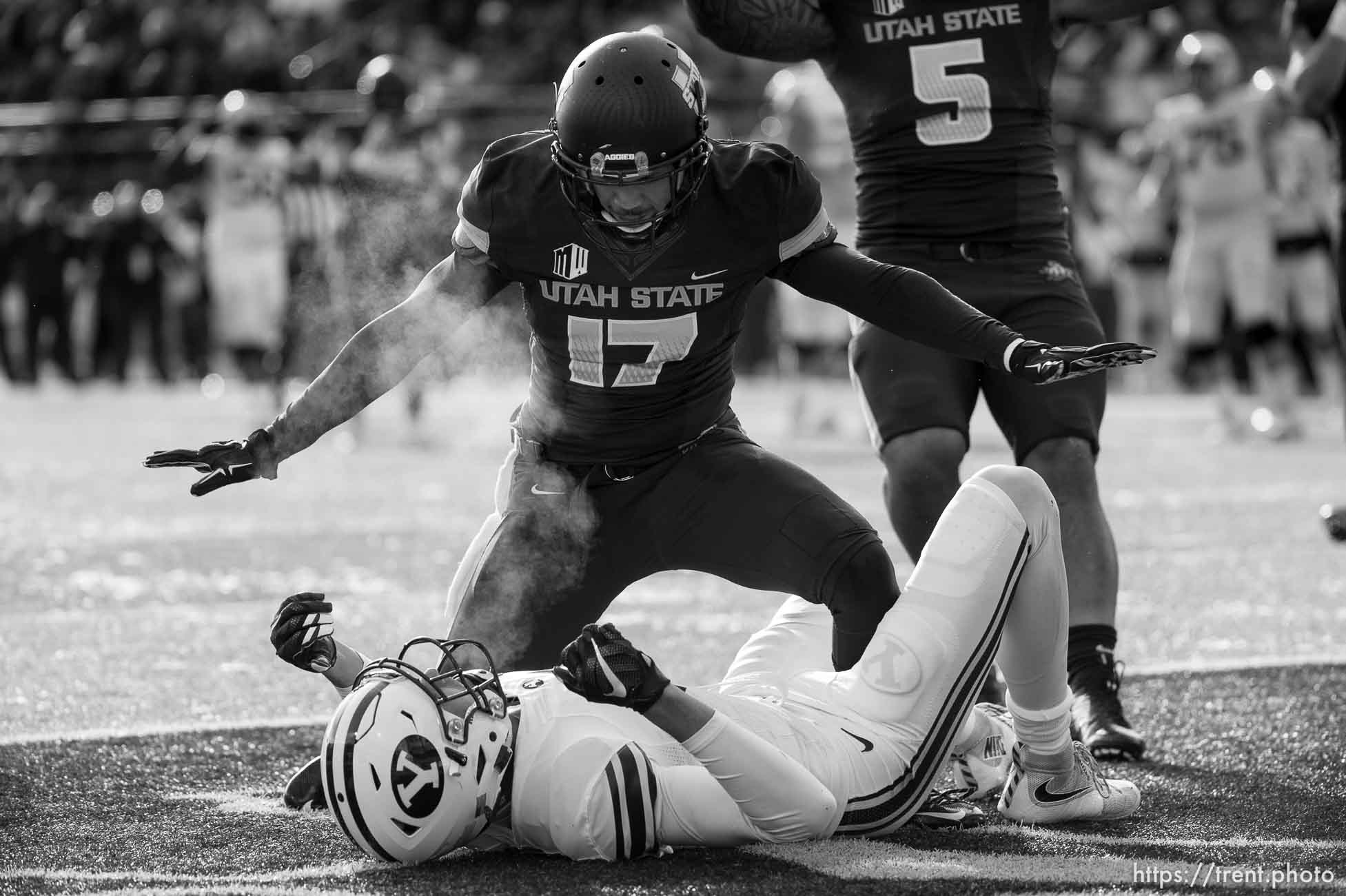 Trent Nelson  |  The Salt Lake Tribune
Utah State Aggies cornerback Deshane Hines (17) stands over Brigham Young Cougars wide receiver Nick Kurtz (5) after he couldn't pull in a touchdown pass as Utah State hosts BYU, NCAA football in Logan, Saturday November 28, 2015. Utah State Aggies linebacker LT Filiaga (5) at right.