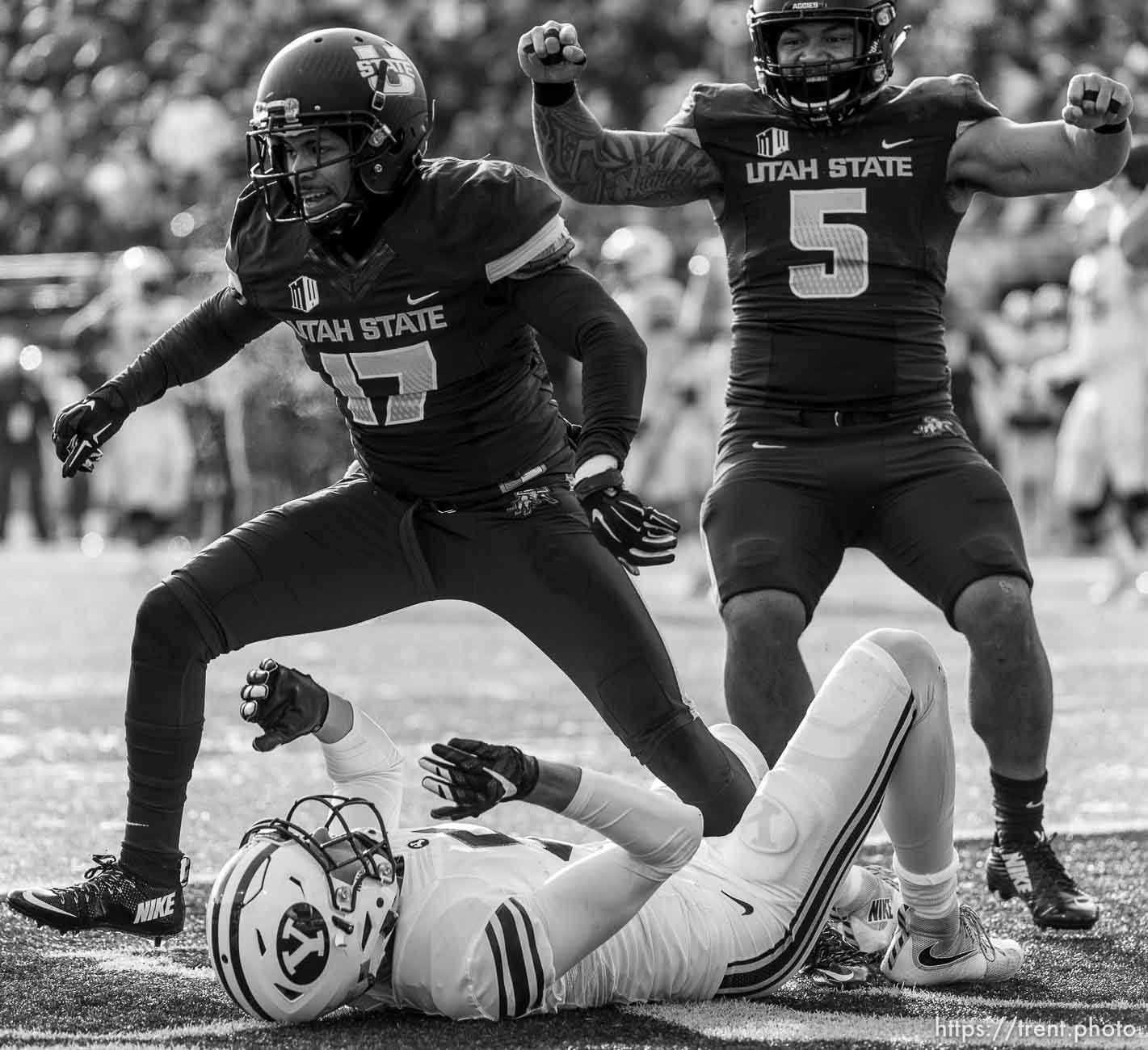 Trent Nelson  |  The Salt Lake Tribune
Utah State Aggies cornerback Deshane Hines (17) stands over Brigham Young Cougars wide receiver Nick Kurtz (5) after he couldn't pull in a touchdown pass as Utah State hosts BYU, NCAA football in Logan, Saturday November 28, 2015. Utah State Aggies linebacker LT Filiaga (5) at right.