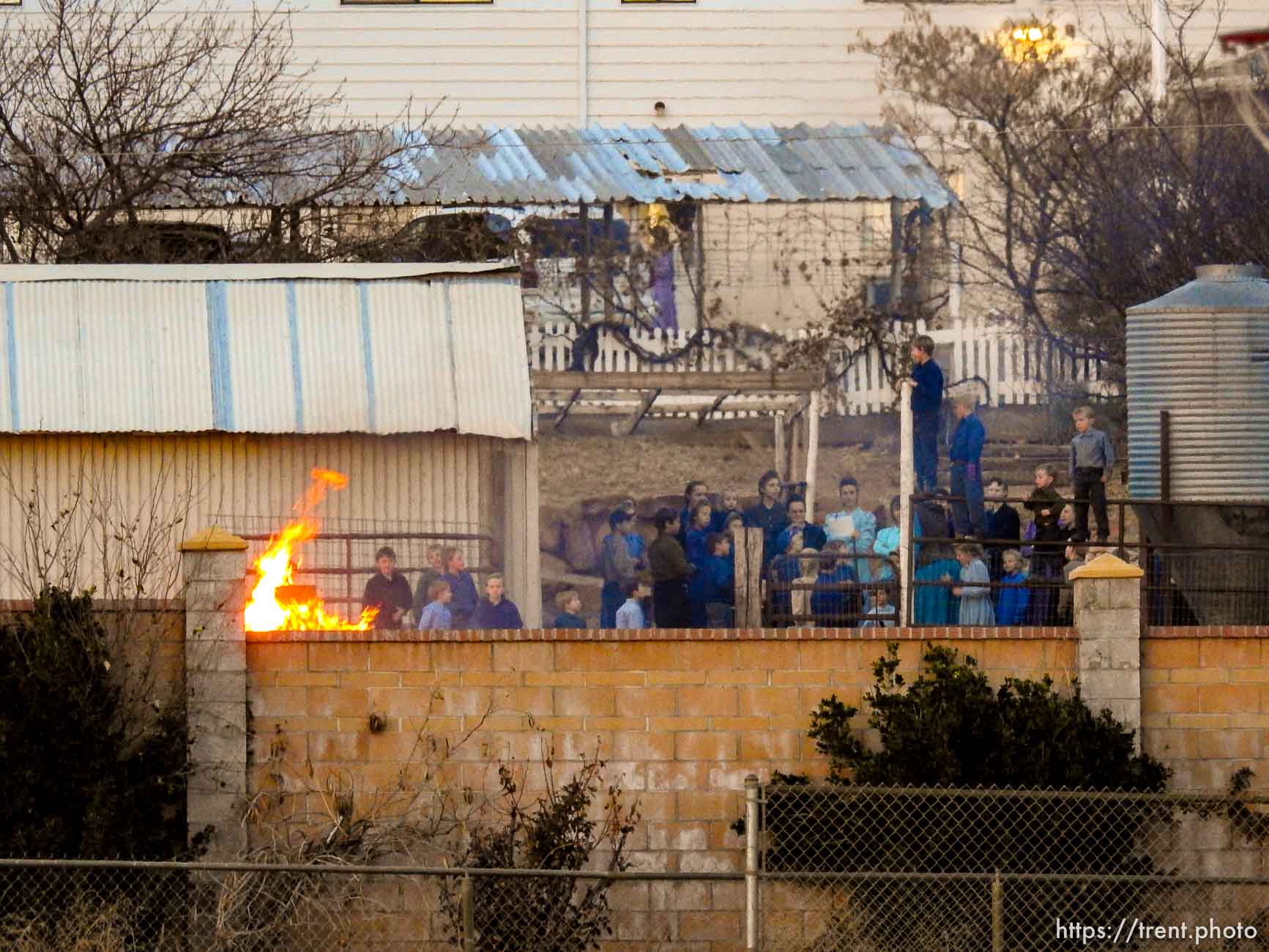 Trent Nelson  |  The Salt Lake Tribune
People look on as a fire burns at the clinic in Hildale, Wednesday December 2, 2015.