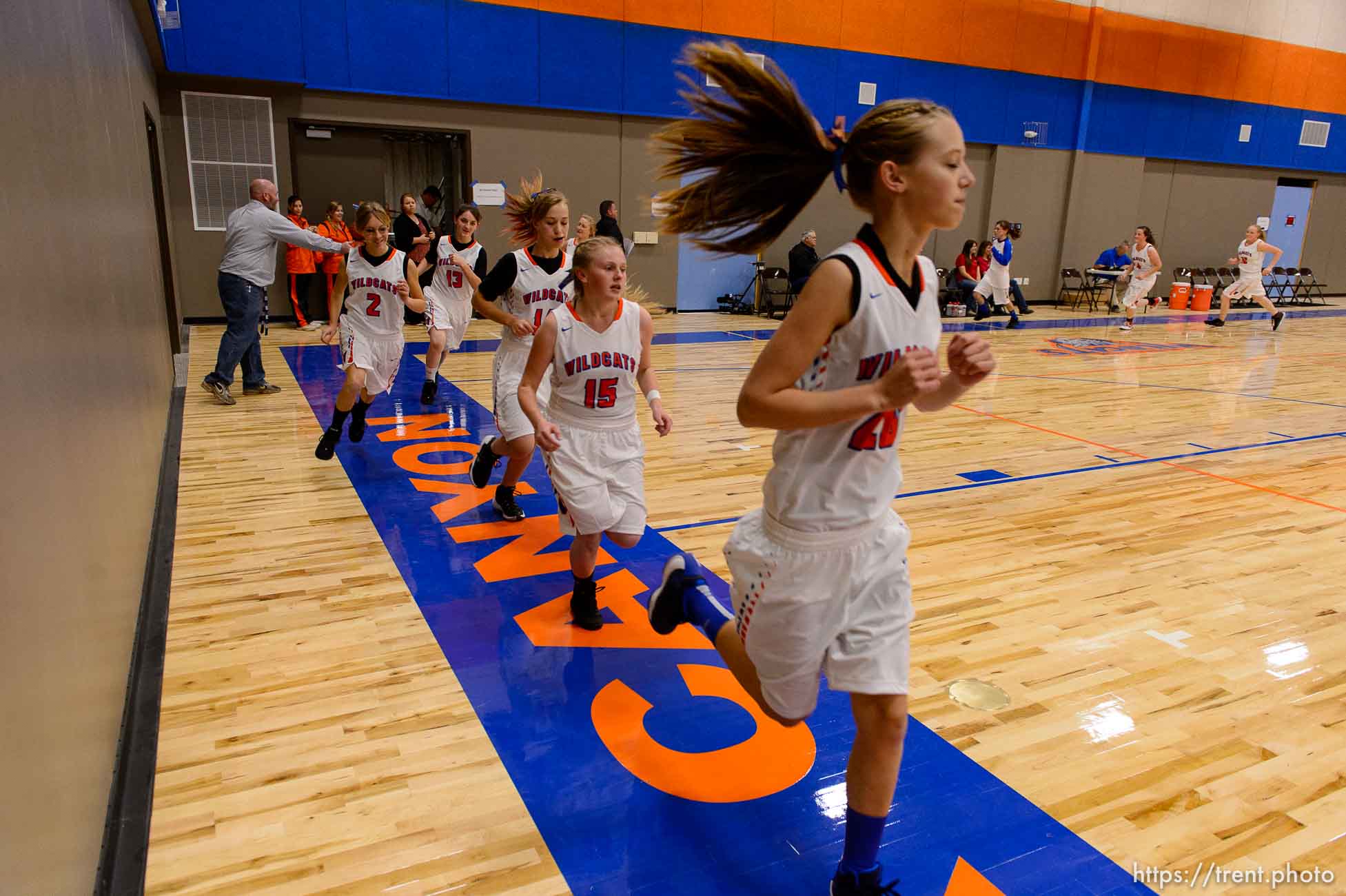 Trent Nelson  |  The Salt Lake Tribune
Players on the court at Water Canyon School in Hildale as the school's girls' team warms up to play the first high school basketball game in a gym that used to be the FLDS bishop's storehouse, Wednesday December 2, 2015.