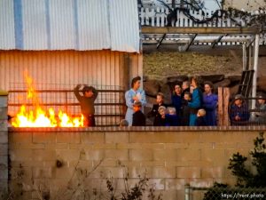 Trent Nelson  |  The Salt Lake Tribune
People look on as a fire burns at the clinic in Hildale, Wednesday December 2, 2015.