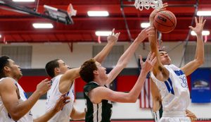 Trent Nelson  |  The Salt Lake Tribune
Bingham's Samuta Avea (32) grabs a rebound as Bingham plays Olympus in the first round of the boys' basketball Elite 8 Tournament at American Fork High School, Thursday December 10, 2015.