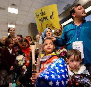 Trent Nelson  |  The Salt Lake Tribune
A large group welcomes a refugee family from Afghanistan (Hassan Ali, his wife Fozia, and their five children) to the Salt Lake City International Airport, Thursday February 2, 2017. The family members are likely the last refugees to arrive in Utah for the foreseeable future, as President Donald Trump's immigration ban takes effect. Left to right in front are Zahra Hassan Barat and Ghulam Mahdi Hassan Barat.