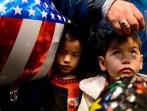 Trent Nelson  |  The Salt Lake Tribune
A large group welcomes a refugee family from Afghanistan (Hassan Ali, his wife Fozia, and their five children) to the Salt Lake City International Airport, Thursday February 2, 2017. The family members are likely the last refugees to arrive in Utah for the foreseeable future, as President Donald Trump's immigration ban takes effect. Left to right are Maryam Hassan Barat and Ghulam Mahdi Hassan Barat.